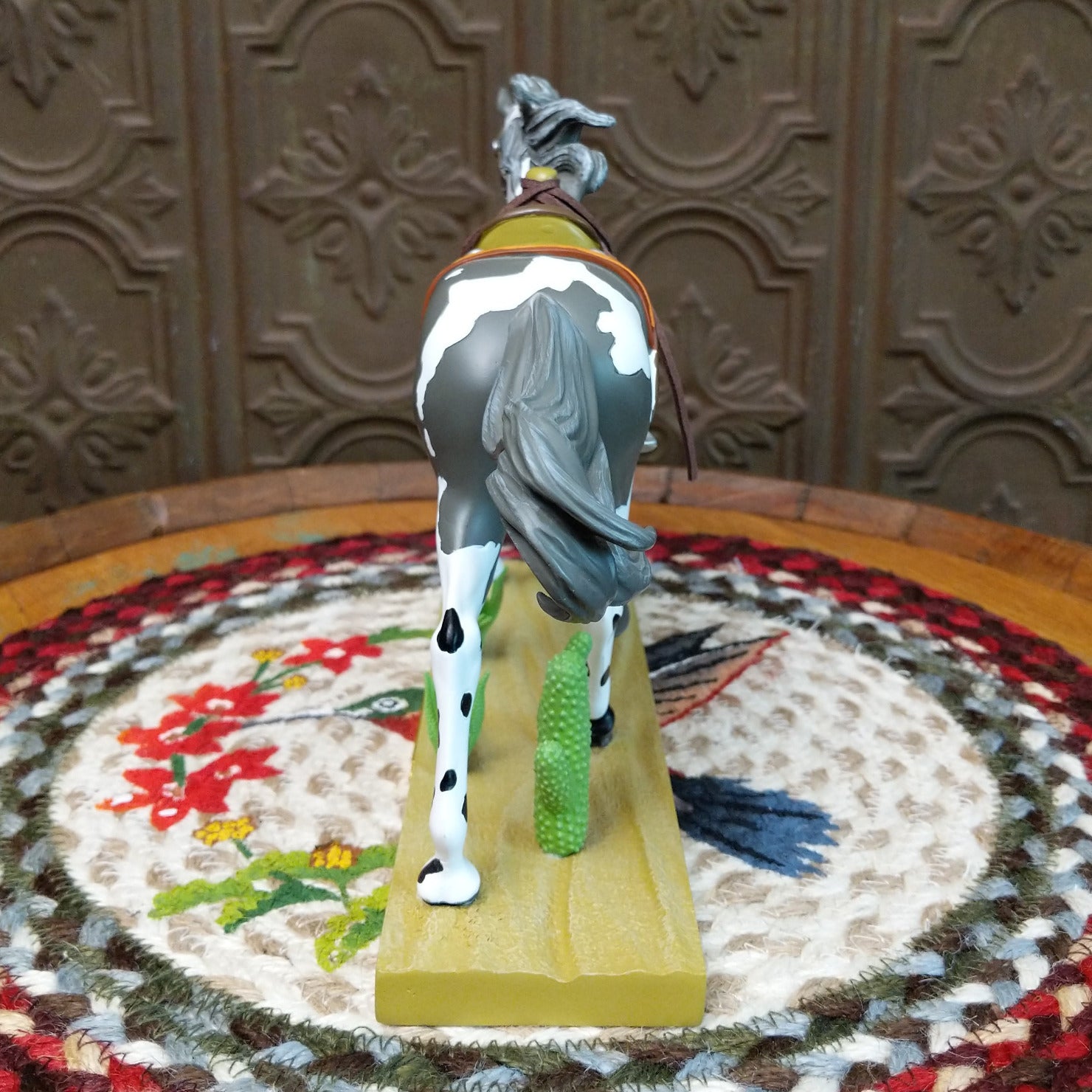 "Desert Buckaroo" collectible pony by The Trail of Painted Ponies, featuring detailed hand-painted desert-inspired artwork, Western themes, and vibrant colors. Rear view.