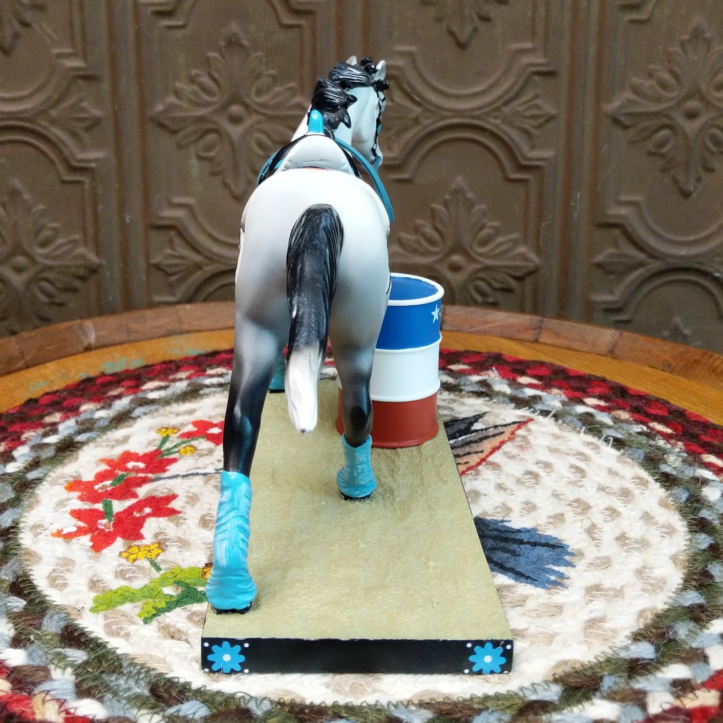 "Blazing Barrels" collectible pony by The Trail of Painted Ponies, featuring detailed hand-painted rodeo-inspired artwork, bold Western designs, and vibrant colors. Rear view.