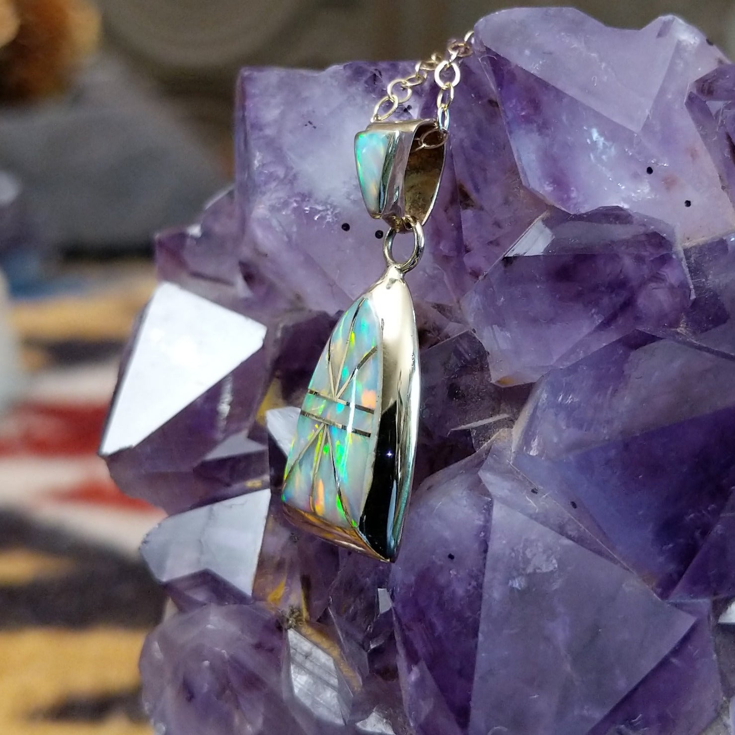 14kt gold Donald Douglas arch pendant with geometric manmade opal inlay and opal bail.