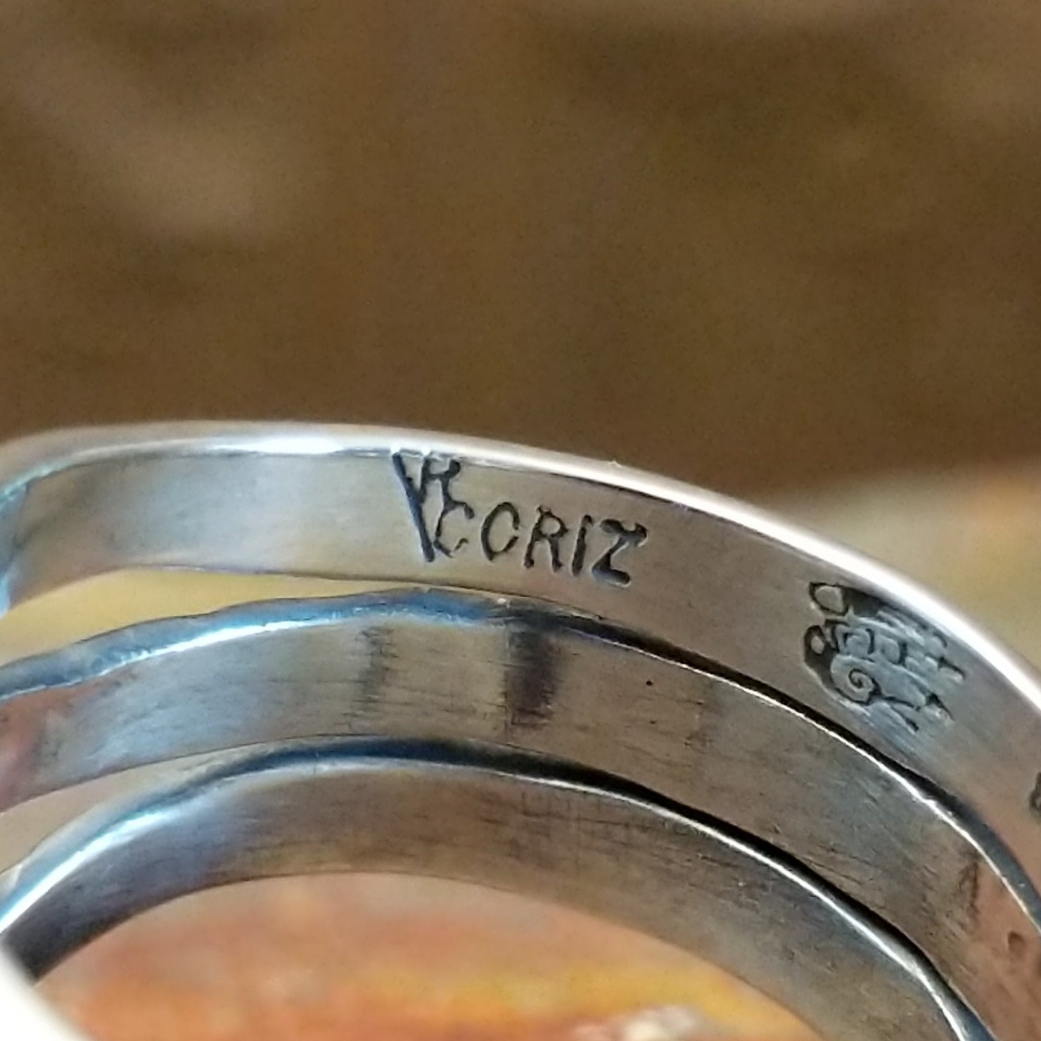 Close-up of the artisan's stamped signature.