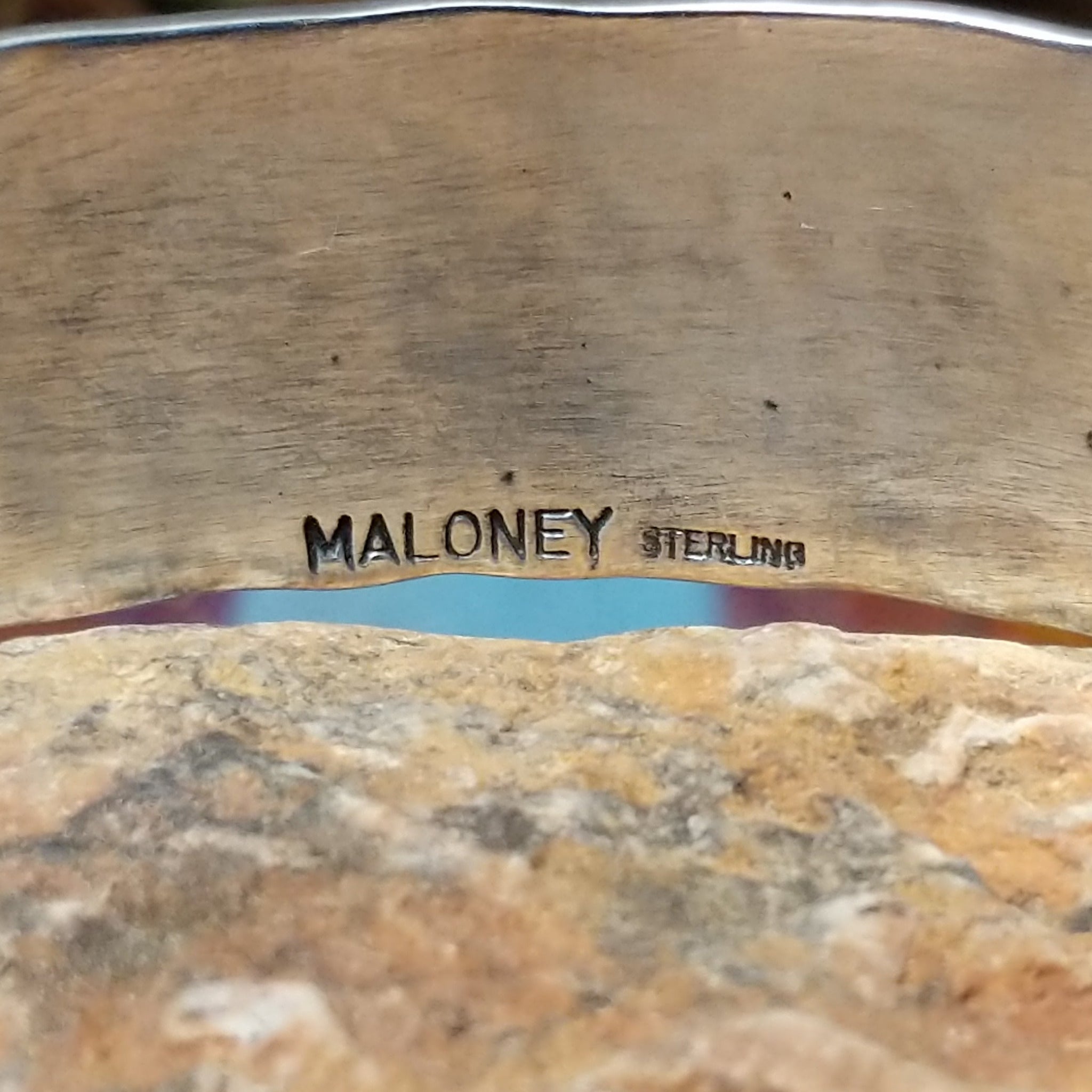 Close up of the artist's stamped signature