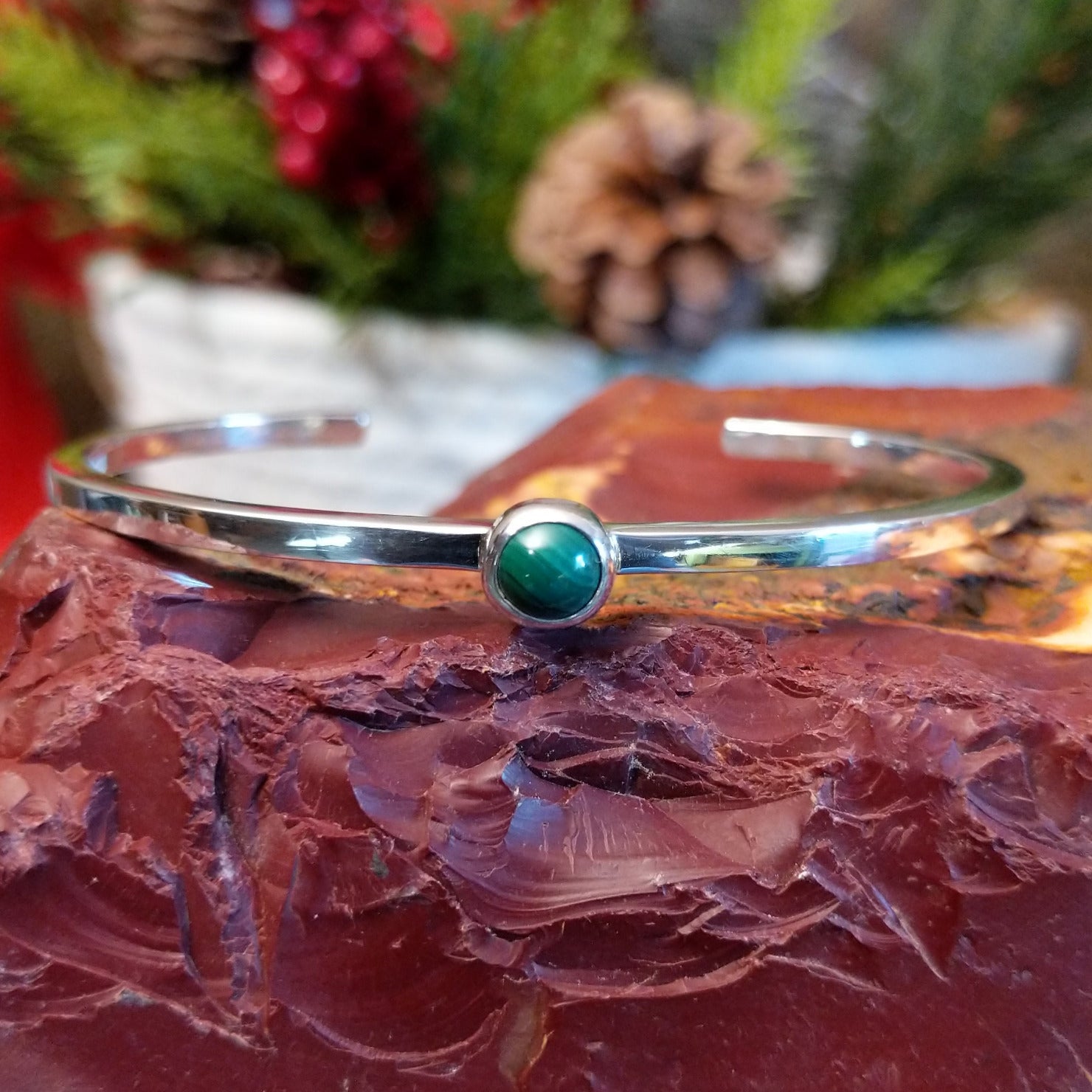 Thin sterling silver cuff bracelet with petite malachite stone set in the bezel.