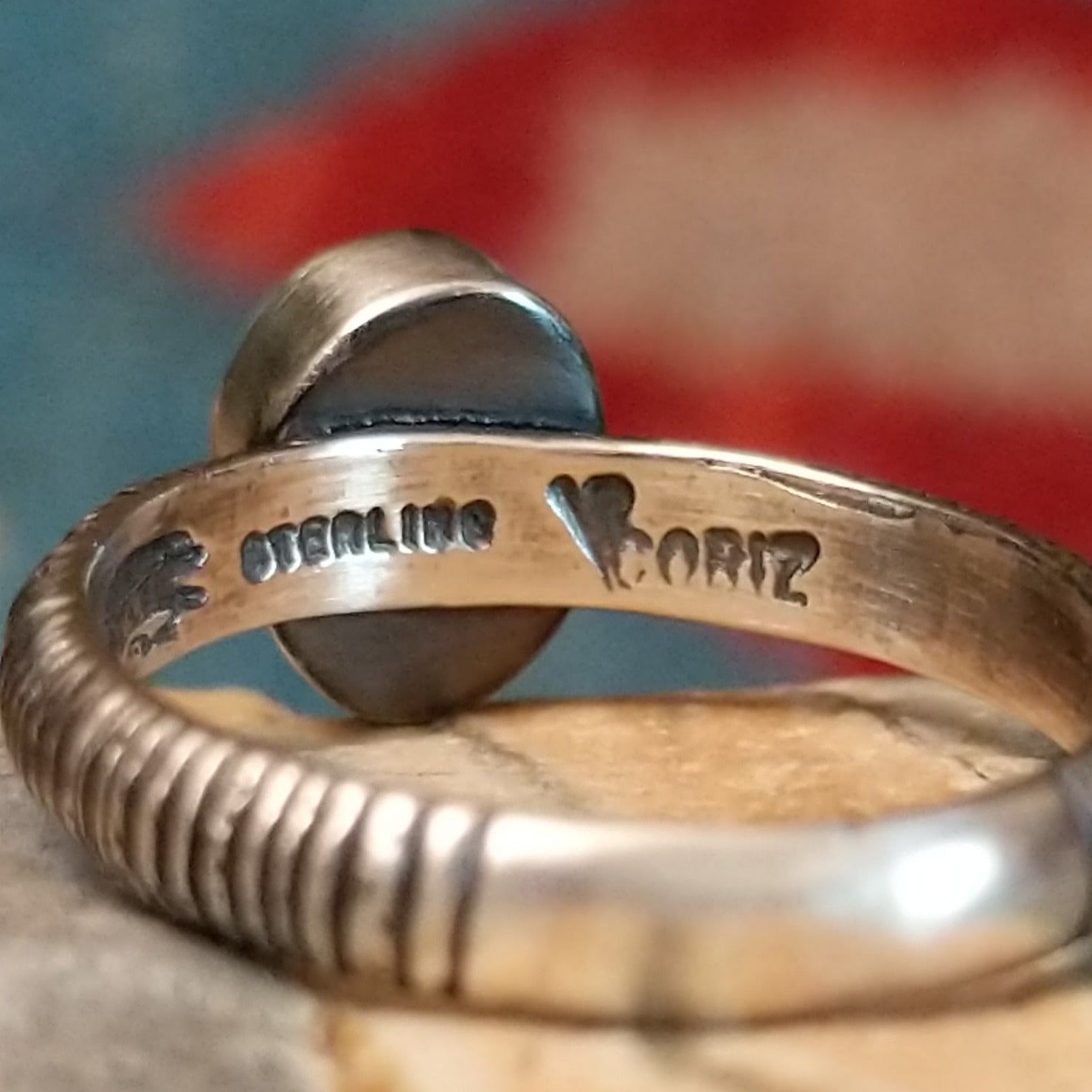 Close-up of the artisan's stamped signature.