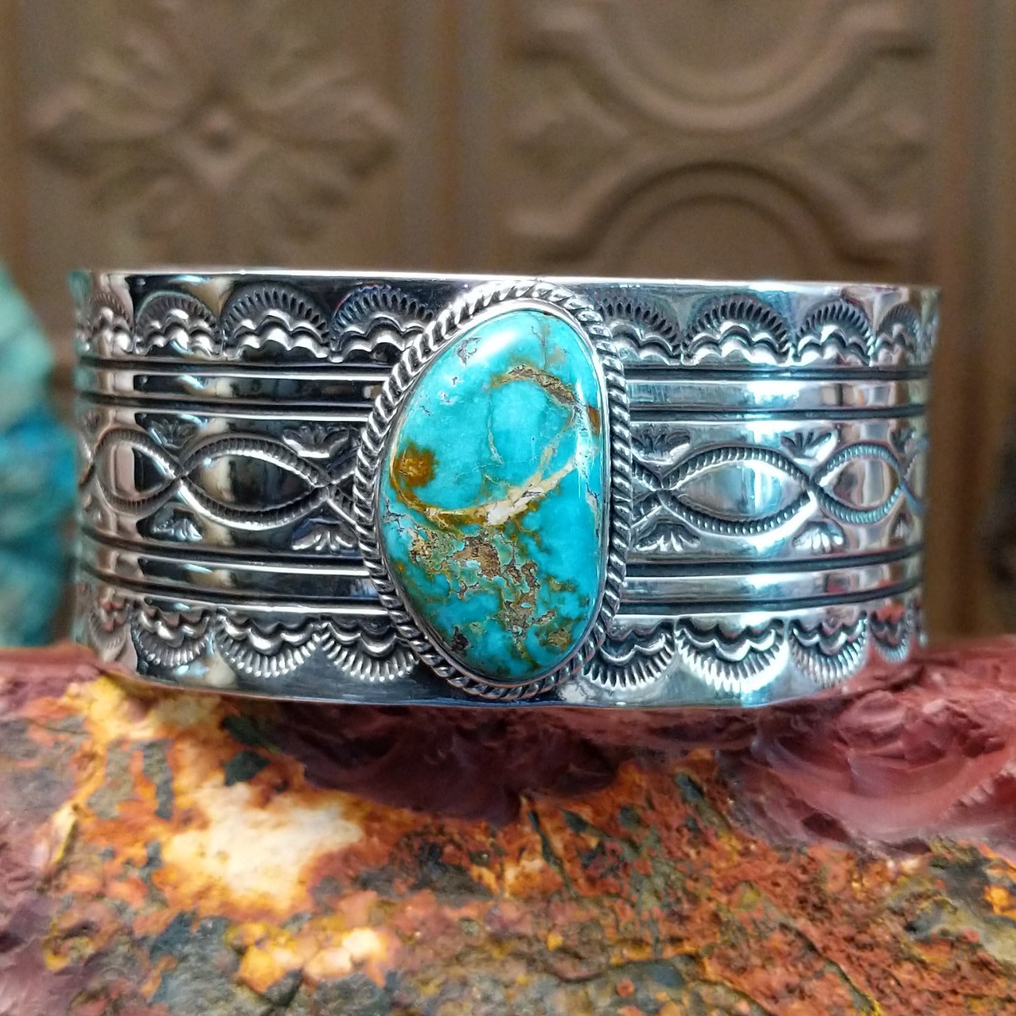 Sterling silver cuff with Sonoran gold turquoise set in twisted rope bezels.