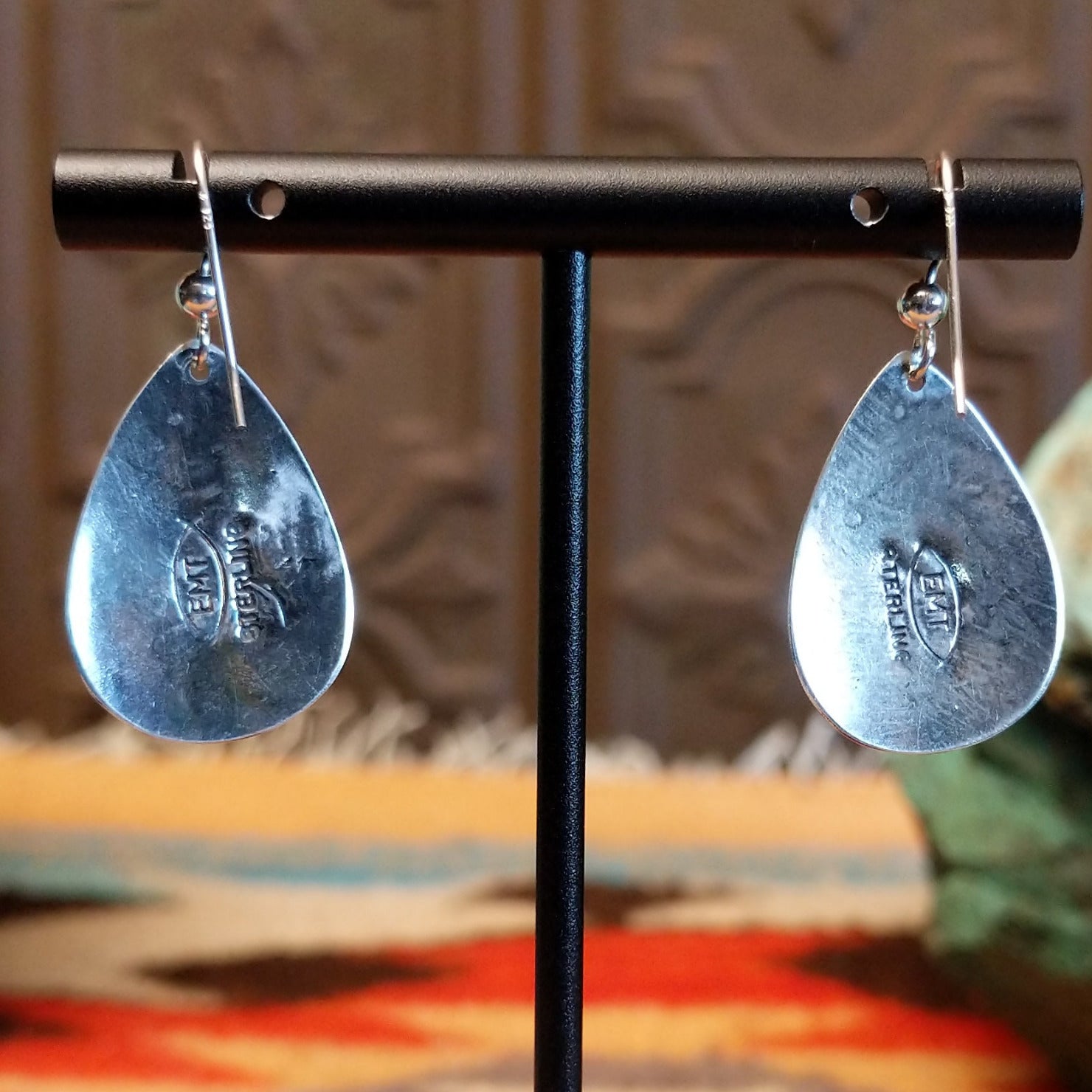 Close-up of the artisans stamped signatures.