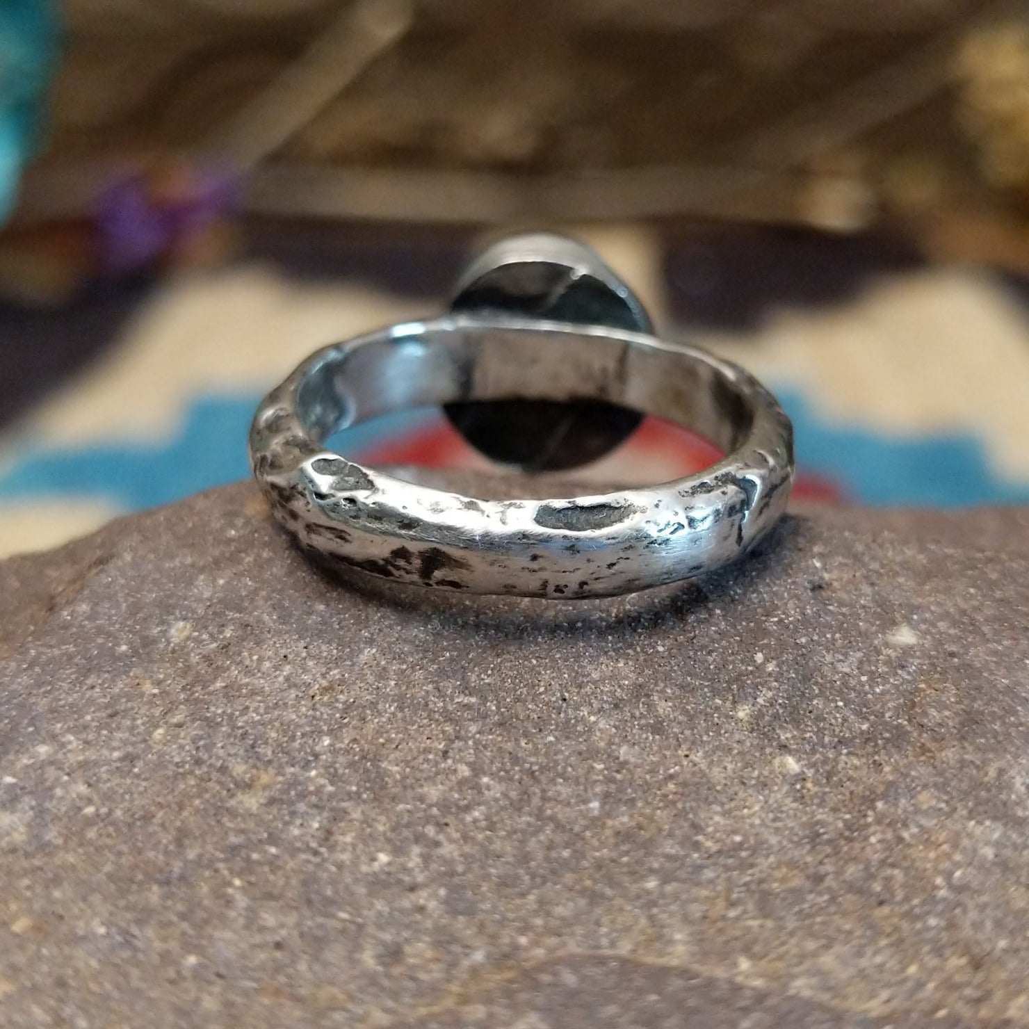 Sterling silver ring featuring Sonoran gold turquoise set in an round bezel with a planished finish.