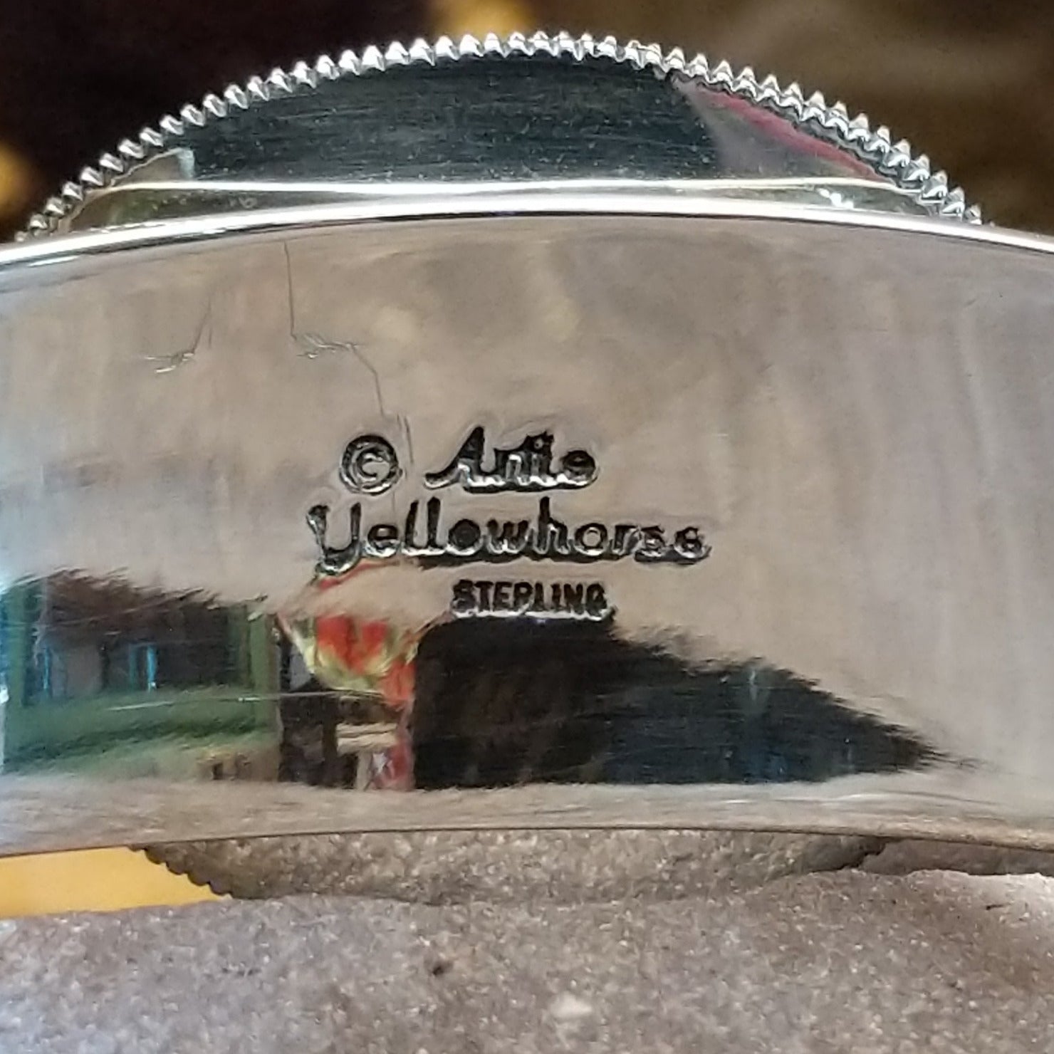 Close up of the artist's stamped signature.