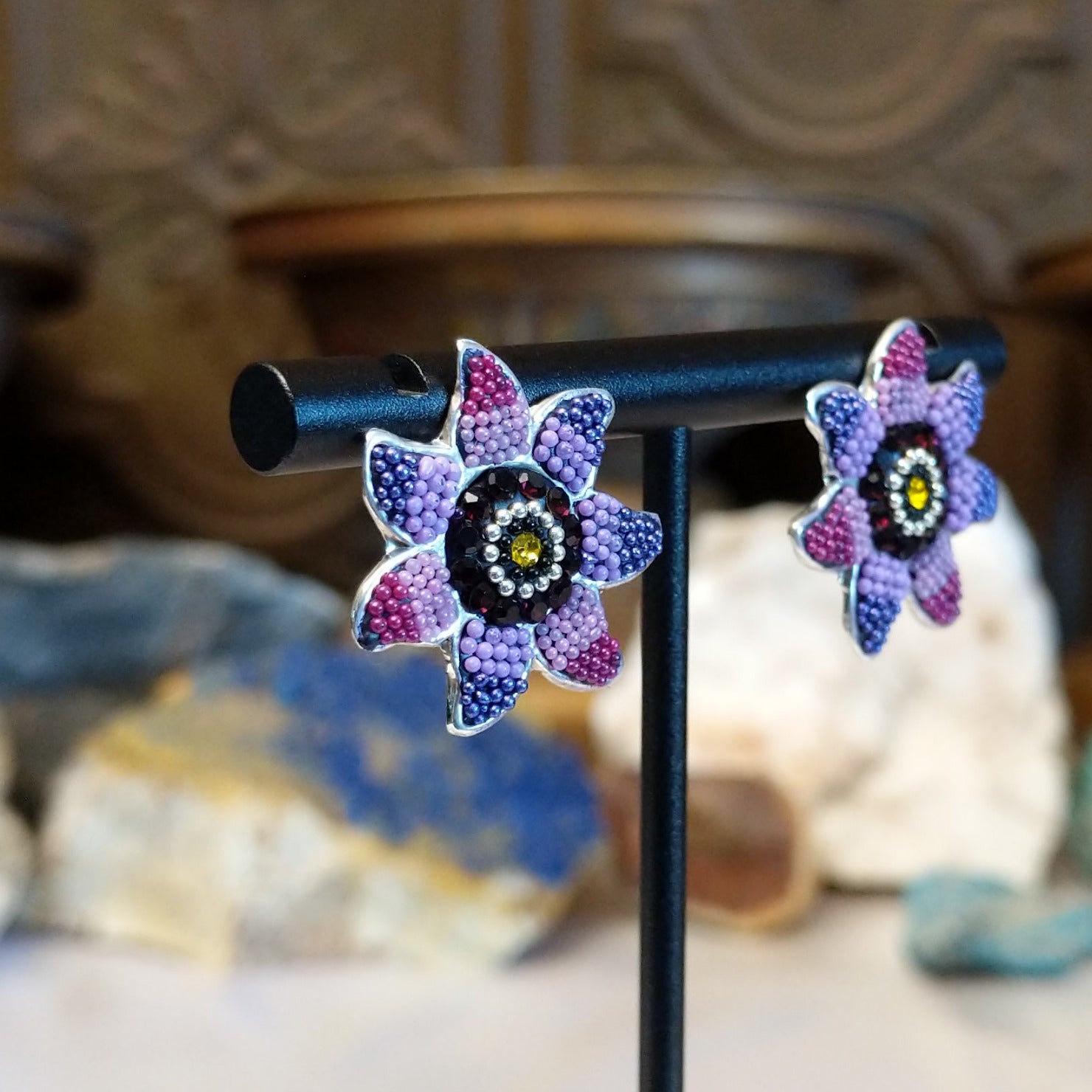 Sterling silver sun earrings with rainbow colored Austrian crystal.