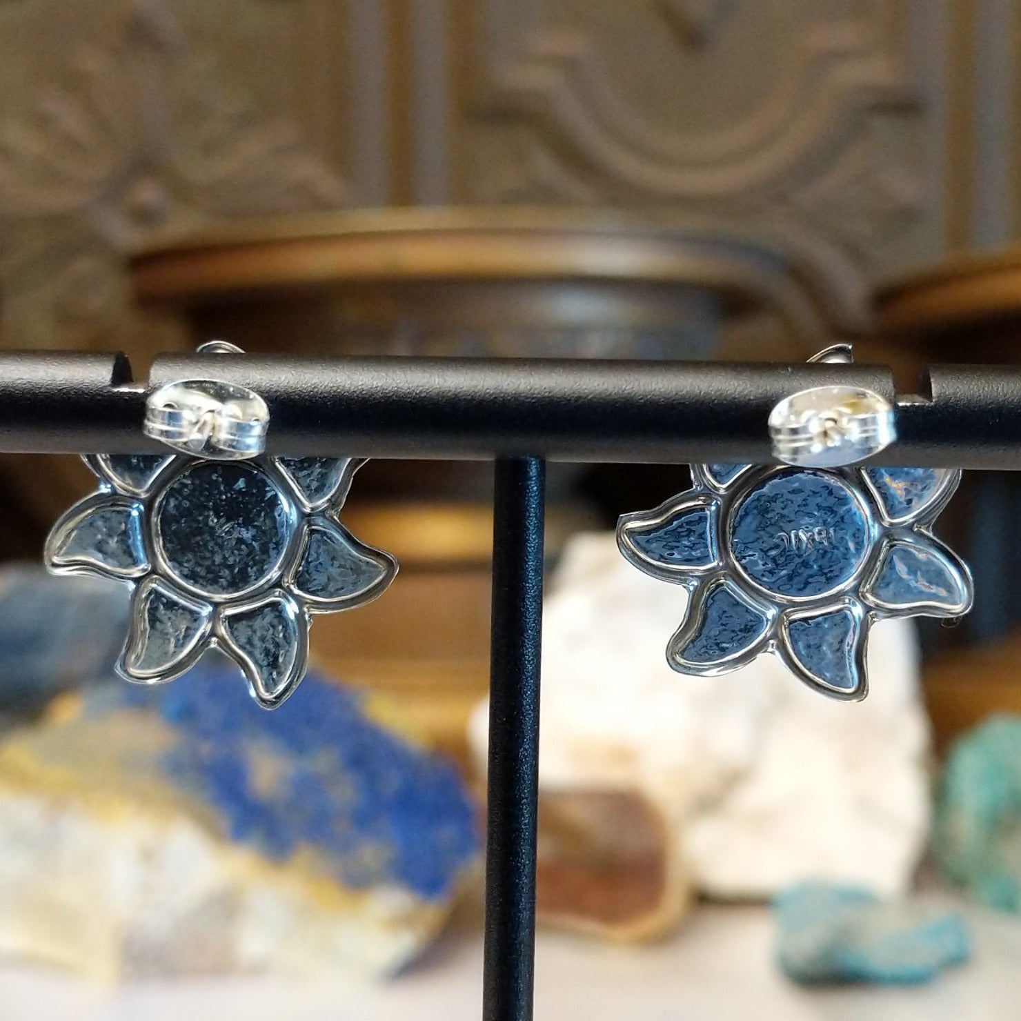 Sterling silver sun earrings with rainbow colored Austrian crystal.