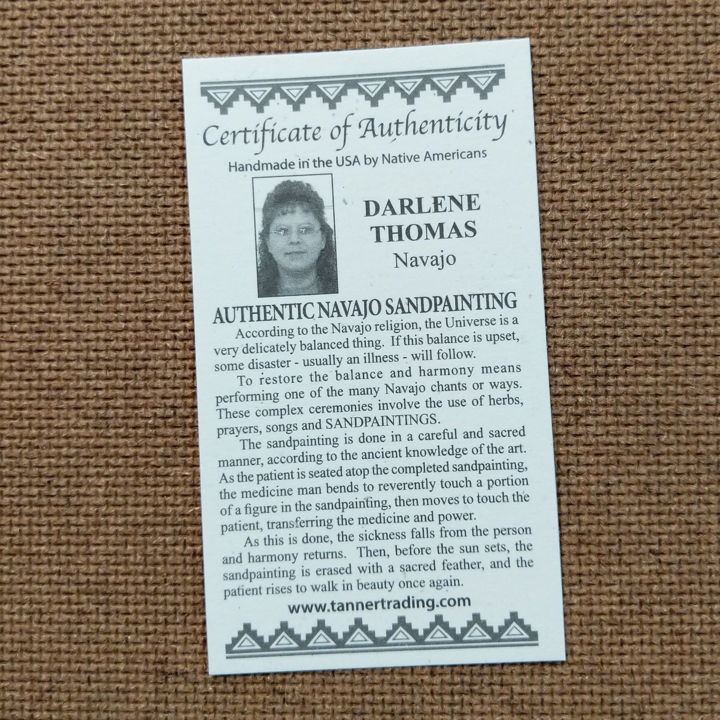 Close up of the Certificate of Authenticity and Artist information.