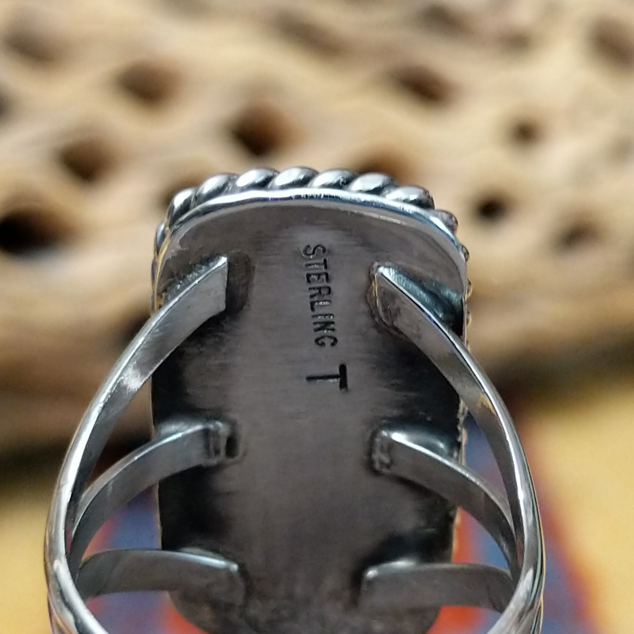 Rectangle bumblebee jasper ring by Terry Wood, featuring a vibrant rectangular bumblebee jasper stone with natural yellow, orange, black, and gray patterns set in a handcrafted sterling silver band. Artisan and Sterling Silver stamp.