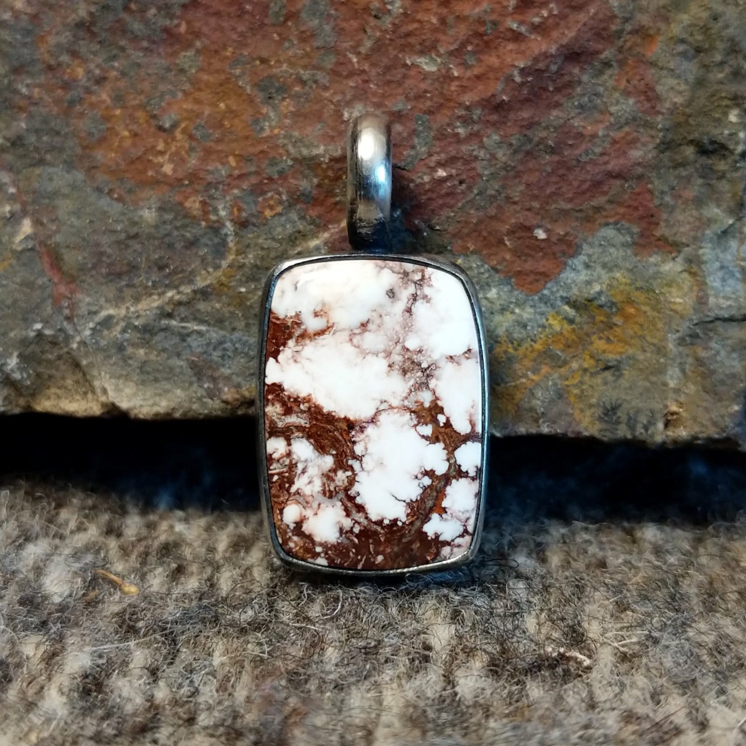 Rectangular wild horse stone set in a sterling silver bezel.