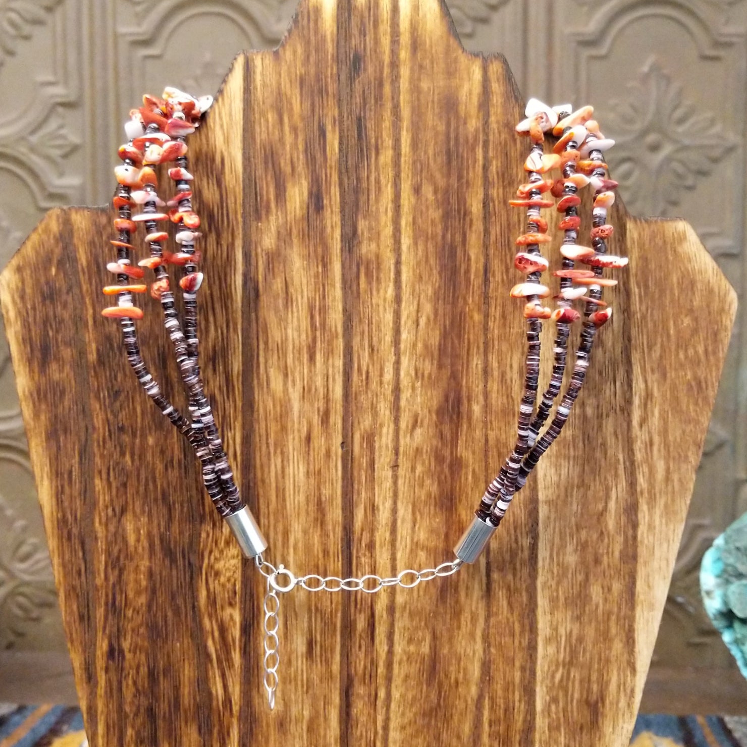 Backing of the necklace featuring the adjustable sterling silver clasp and chain.