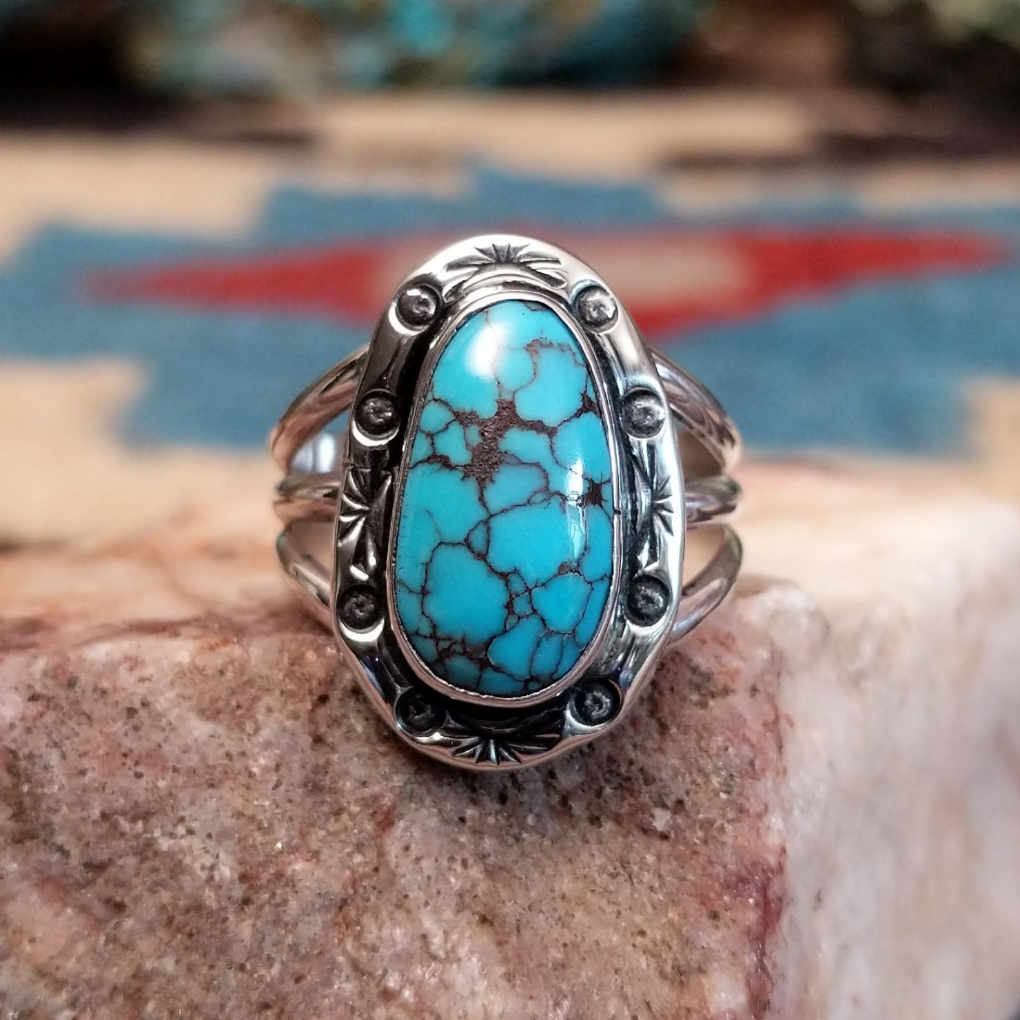 Sterling silver ring with Redskin turquoise set in oval bezel.