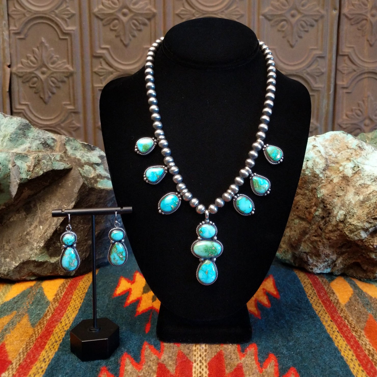Necklace and earrings set with Sonoran Gold turquoise spaced along the beaded silver chain, the bezels are framed by twisted rope and dotted accents.