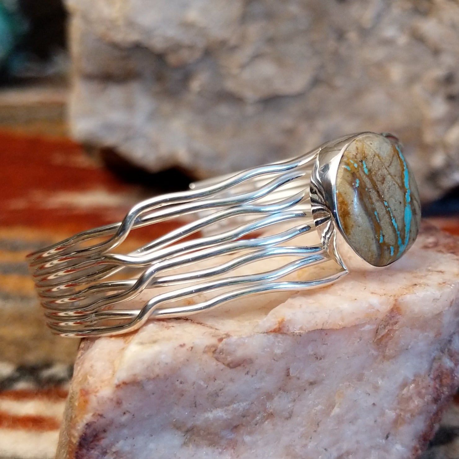 Sterling silver layered wire cuff with round boulder turquoise set in the bezel.