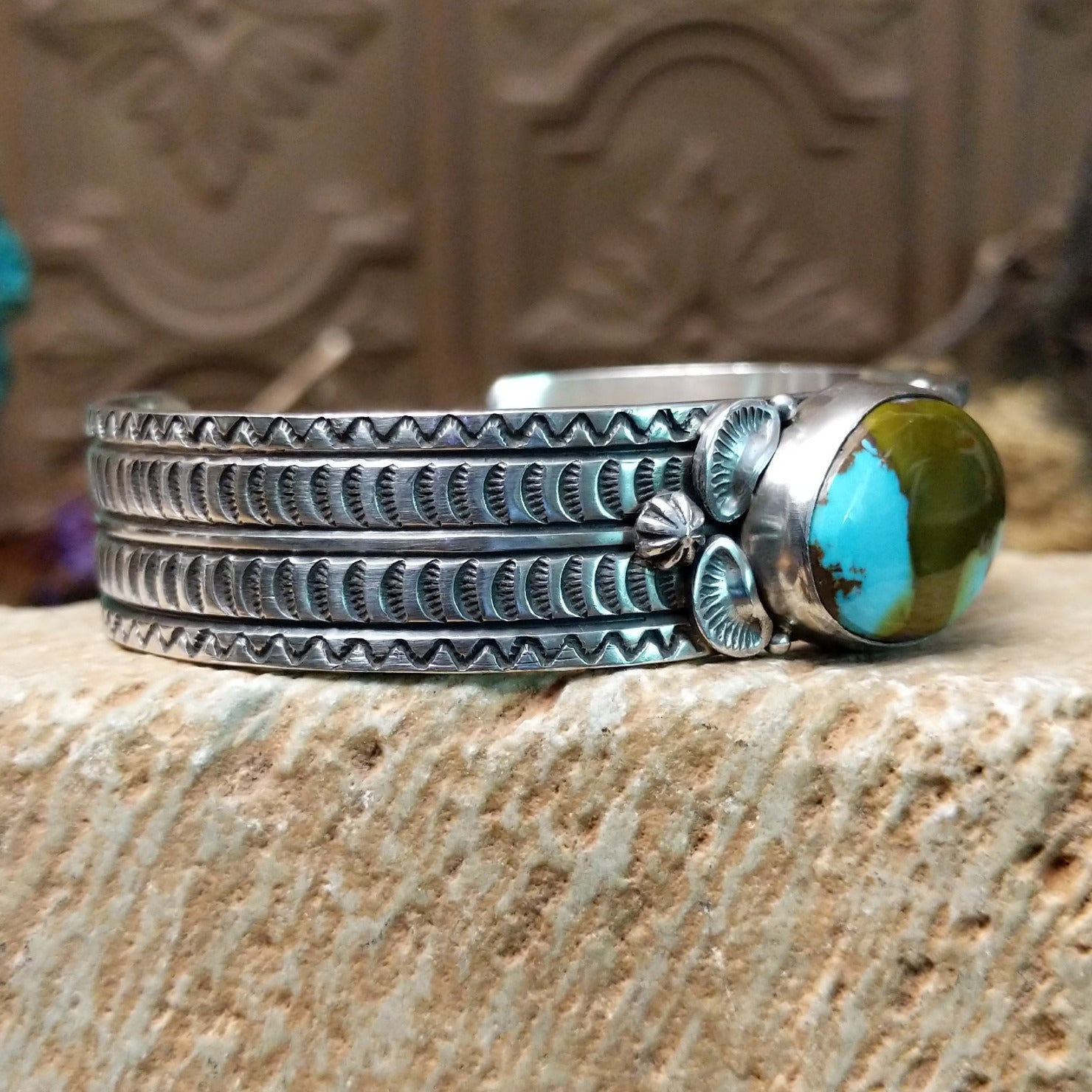 Sterling silver cuff with Royston turquoise set in the oval bezel and geometric stamping on the band.