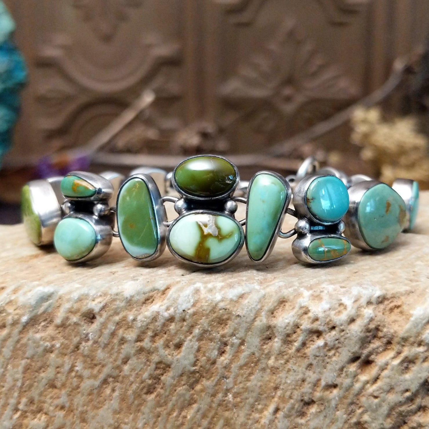 Sterling silver bracelet with Royston turquoise set in various shaped geometric bezels.