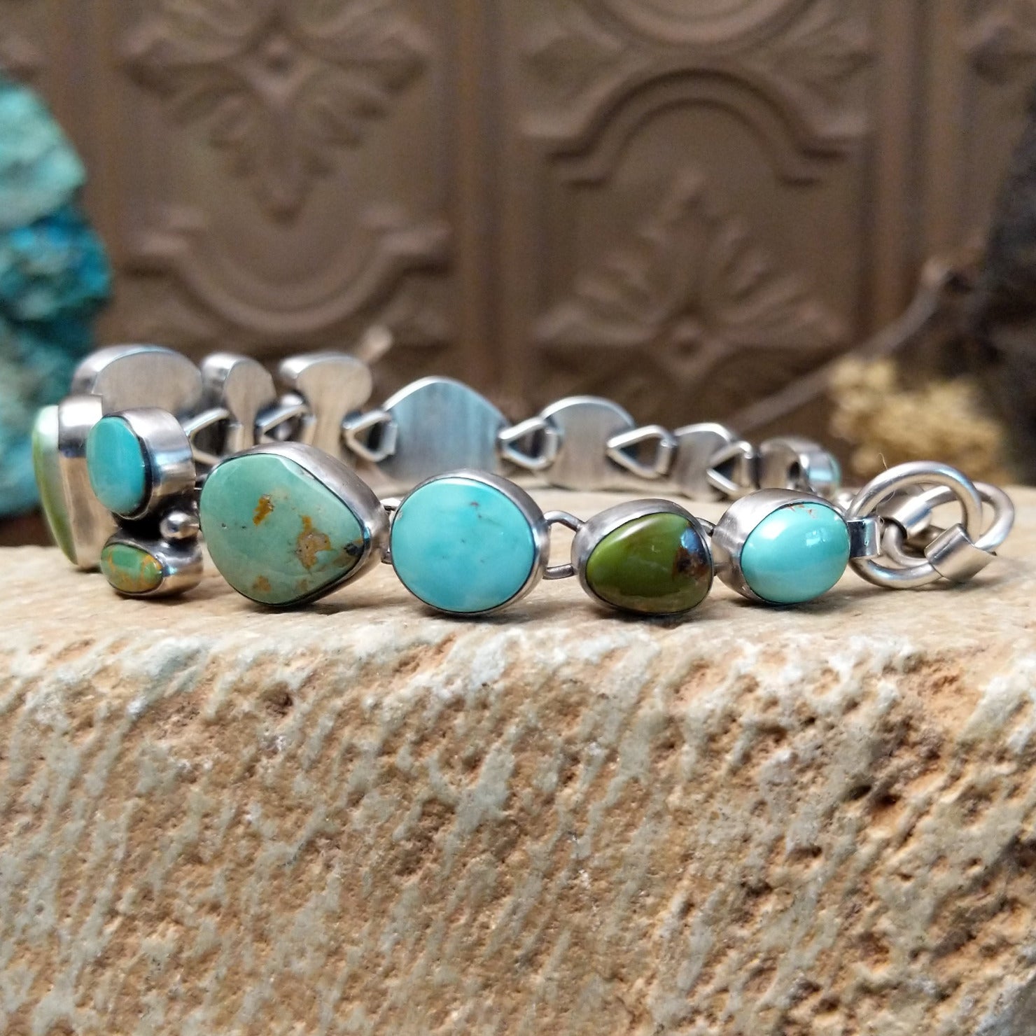 Sterling silver bracelet with Royston turquoise set in various shaped geometric bezels.