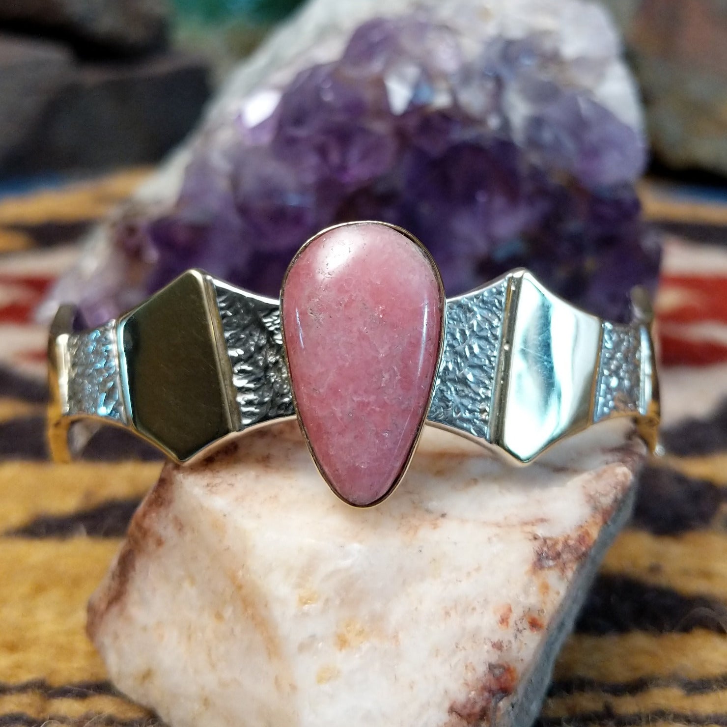 Sterling silver and 14k gold cuff by Marc Antia with pear-shaped rhodochrosite stone.