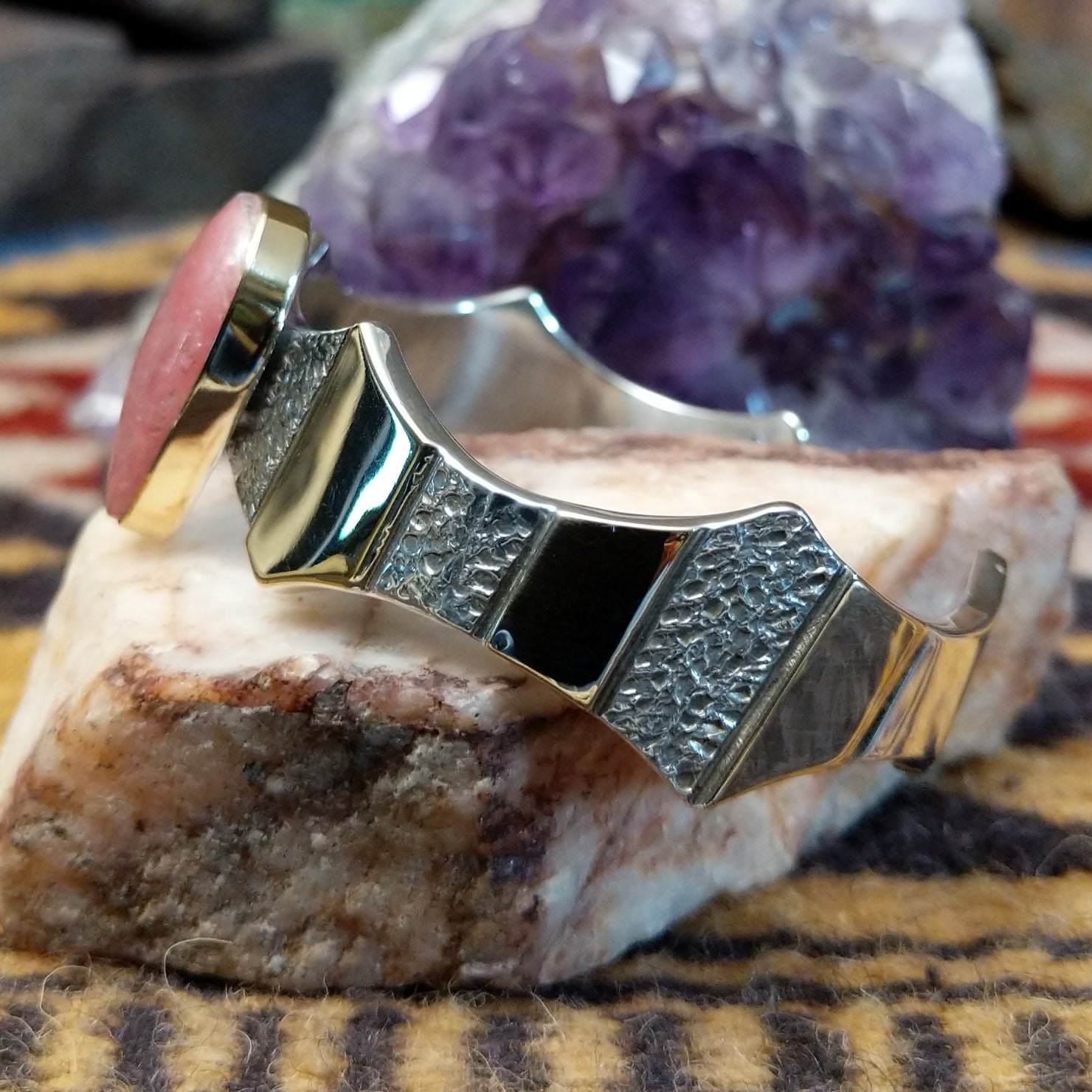 Sterling silver and 14k gold cuff by Marc Antia with pear-shaped rhodochrosite stone.
