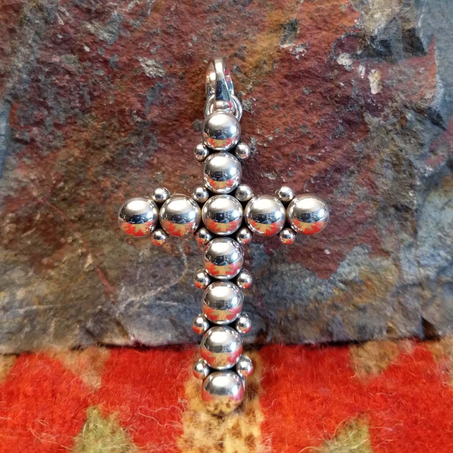Sterling silver beaded cross pendant by Navajo artisan Artie Yellowhorse.