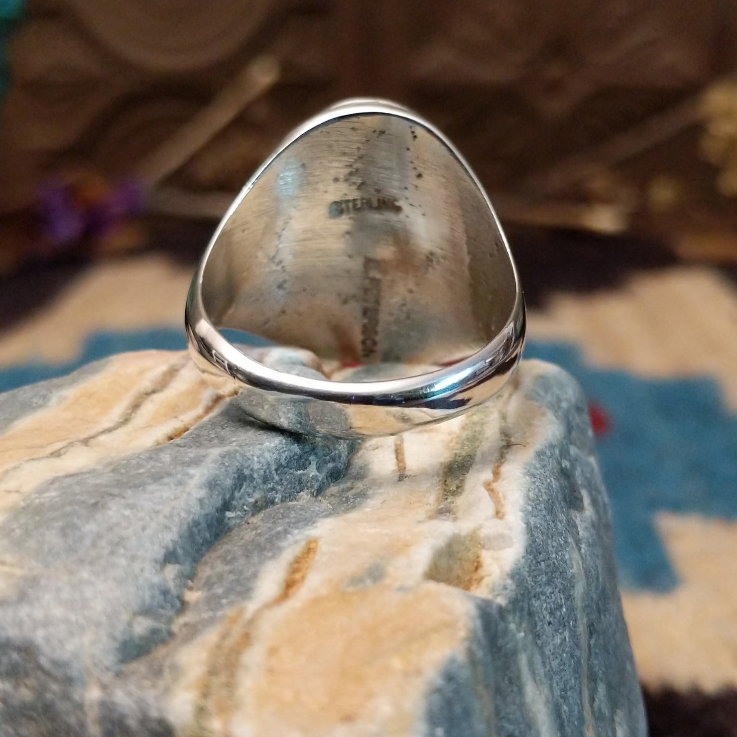 Sterling silver ring with man in the maze motif.
