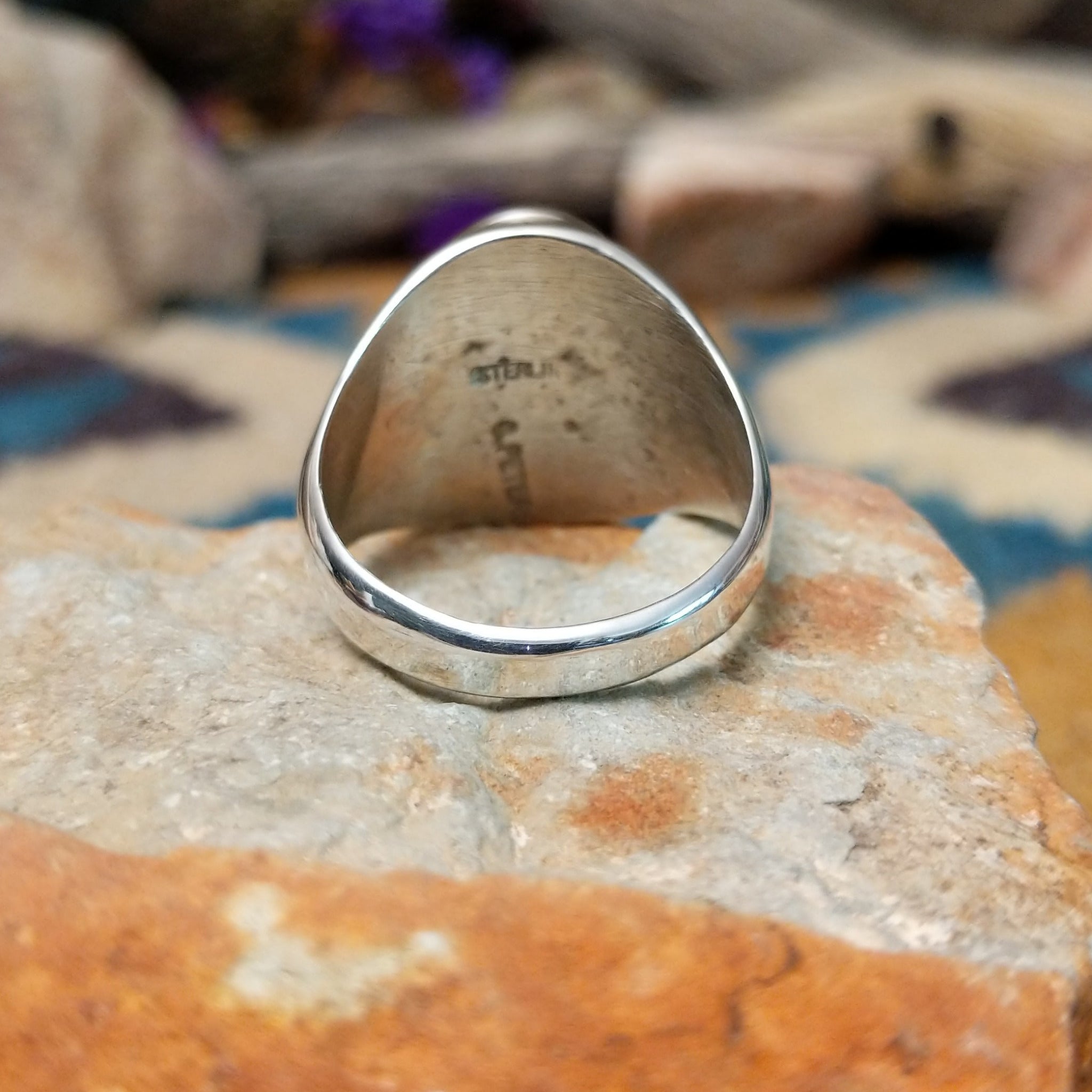 Sterling silver Thunderbird ring by Calvin Peterson with hand-stamped Southwestern detailing; underside view.