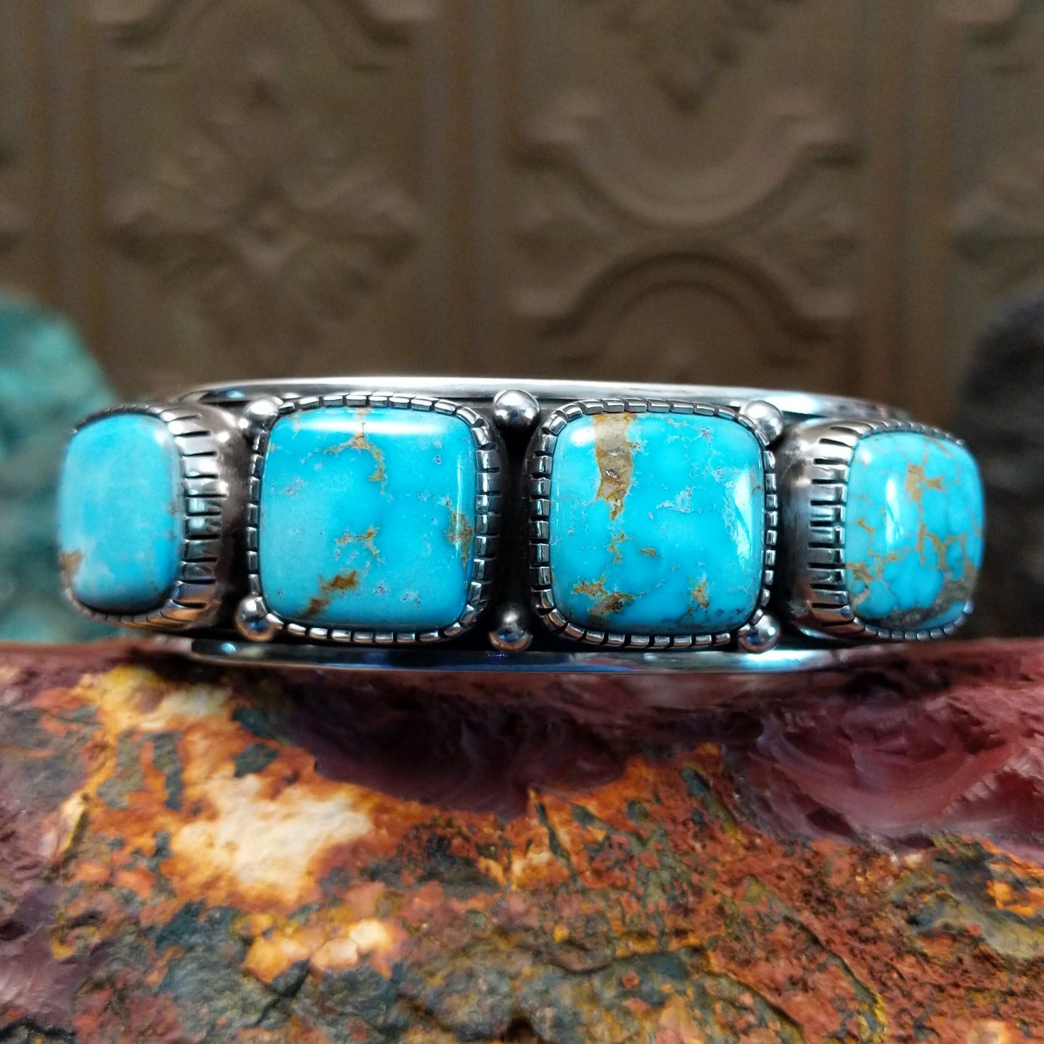 Sterling silver cuff featuring Sonoran gold turquoise set in square, etched bezels.