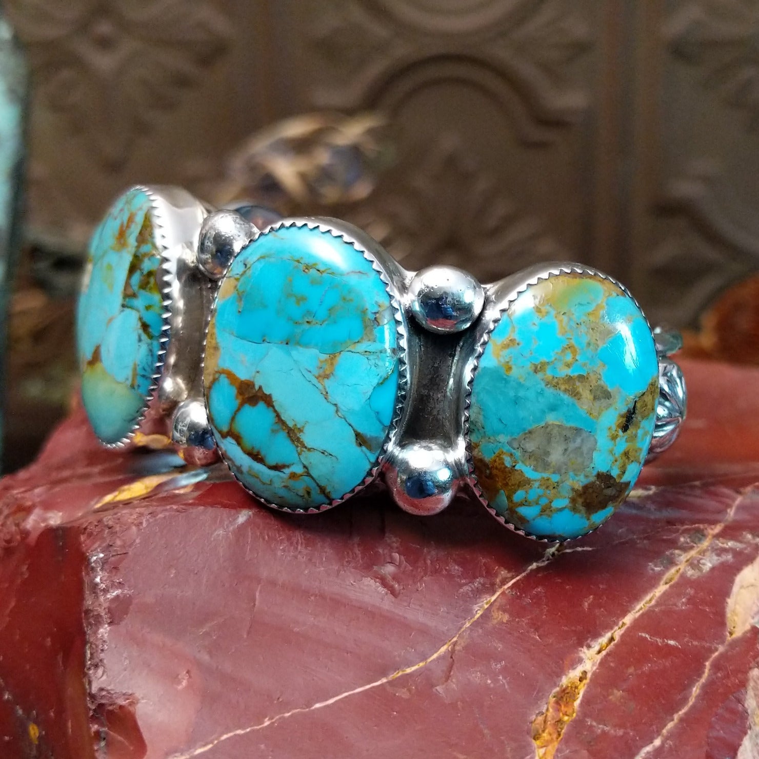 Sterling silver cuff bracelet with Sonoran gold turquoise set in notched, oval bezels.