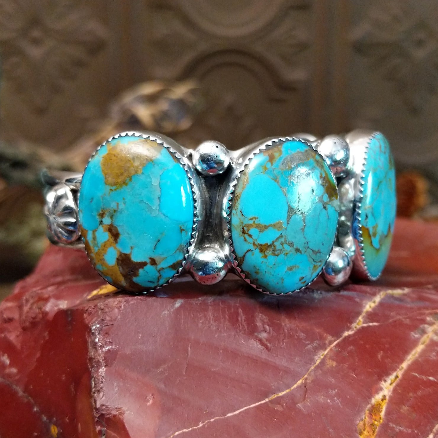 Sterling silver cuff bracelet with Sonoran gold turquoise set in notched, oval bezels.