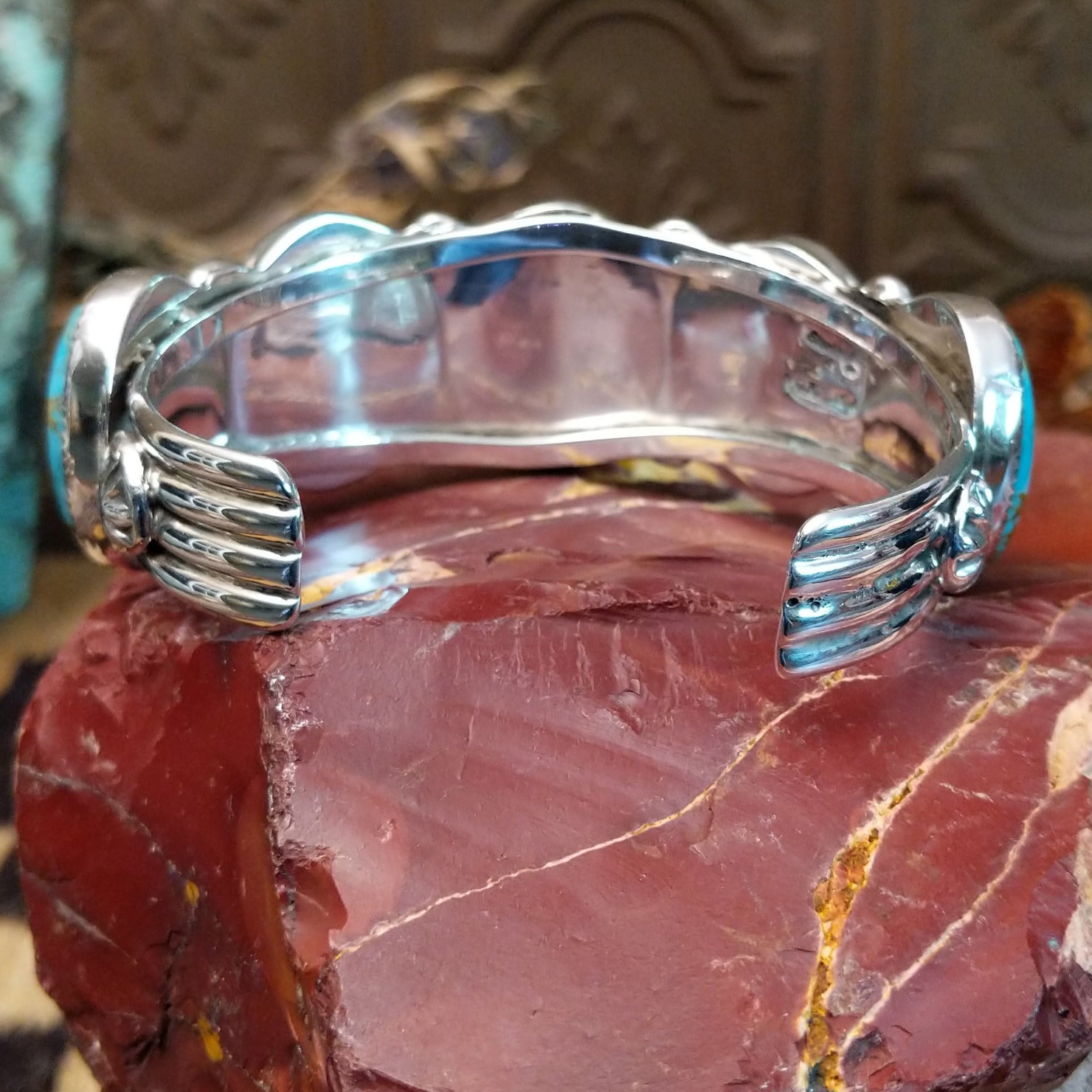 Sterling silver cuff bracelet with Sonoran gold turquoise set in notched, oval bezels.