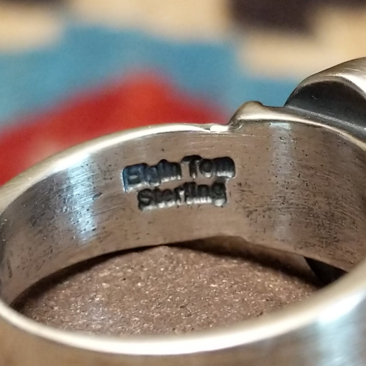 Close-up of the artisan's stamped signature.