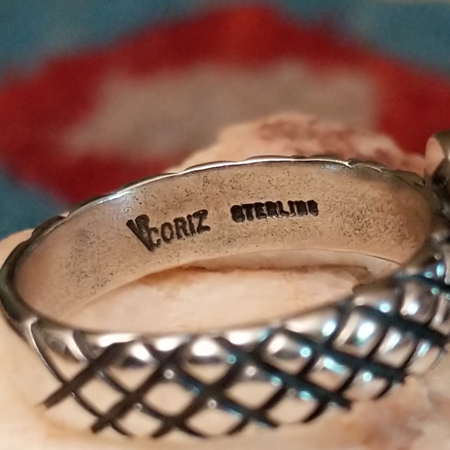 Close-up of the artisan's stamped signature.