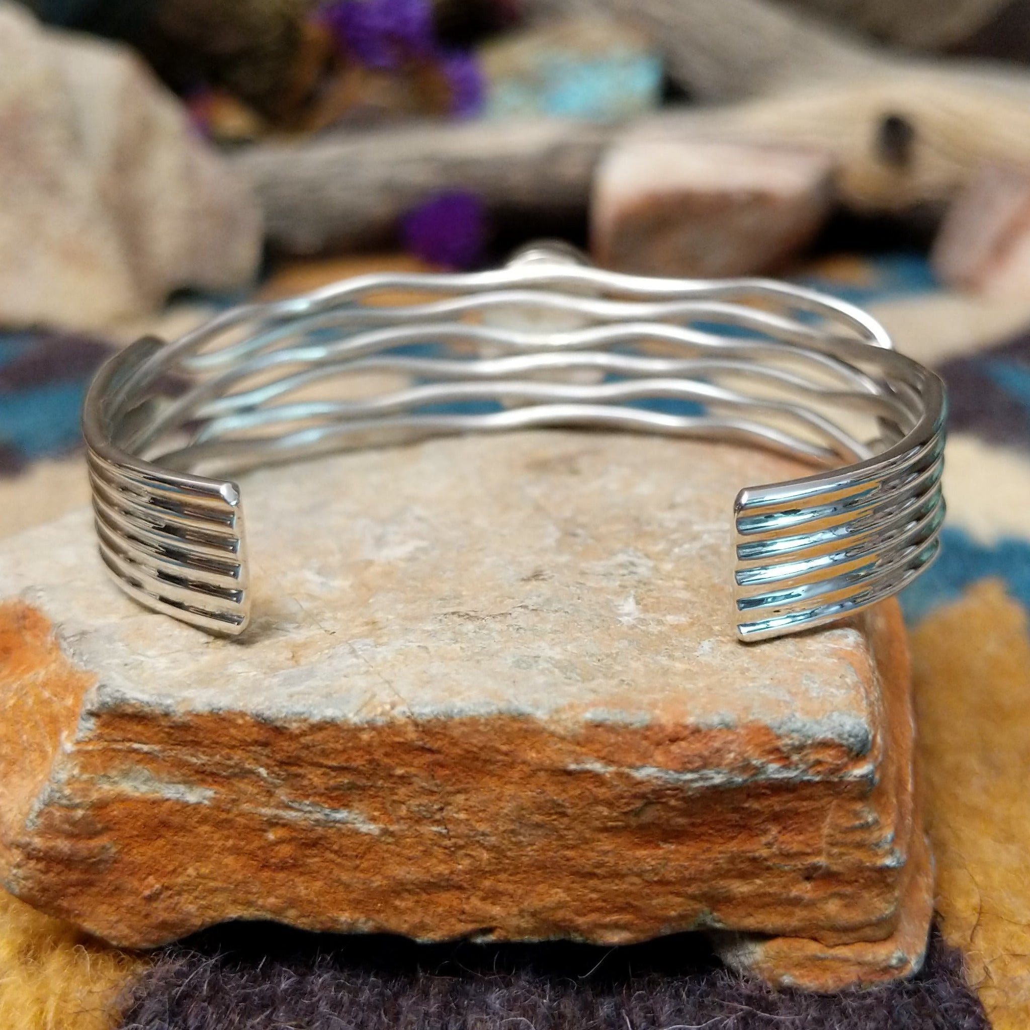 Handcrafted Navajo sterling silver five-strand cuff by Murphy Platero featuring an oval Sonoran Gold turquoise cabochon in a flowing open-wire design; underside view.