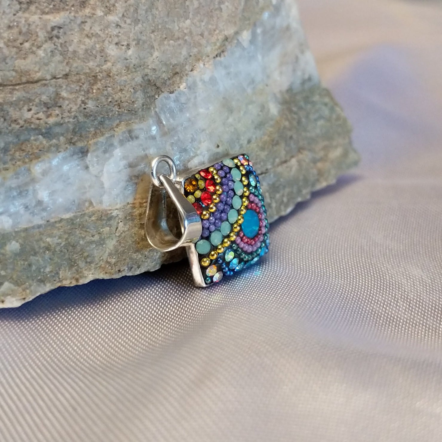Sterling silver square pendant with Austrian crystals.