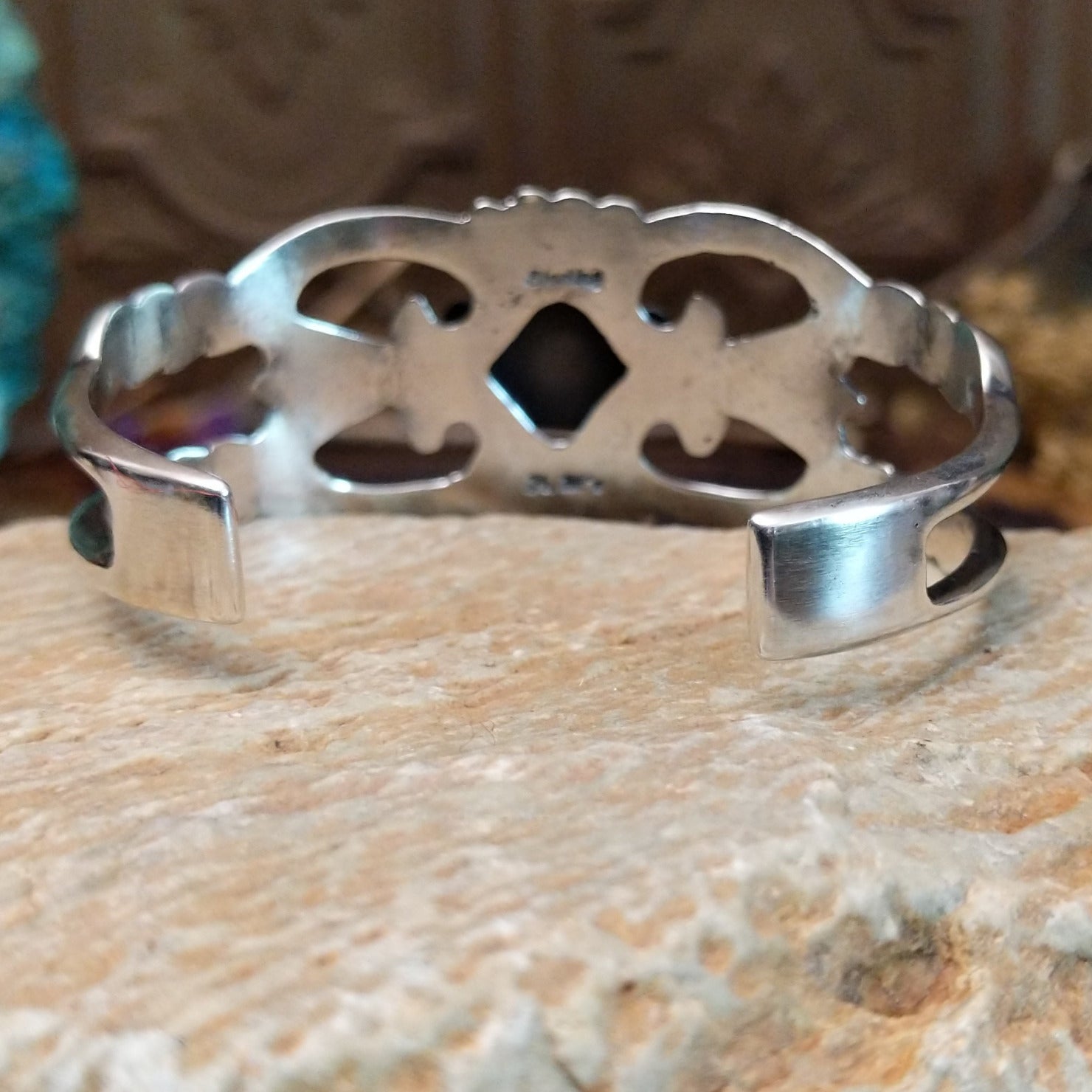 Sterling silver cuff with Royston turquoise set in a square bezel and ornate silverwork band.