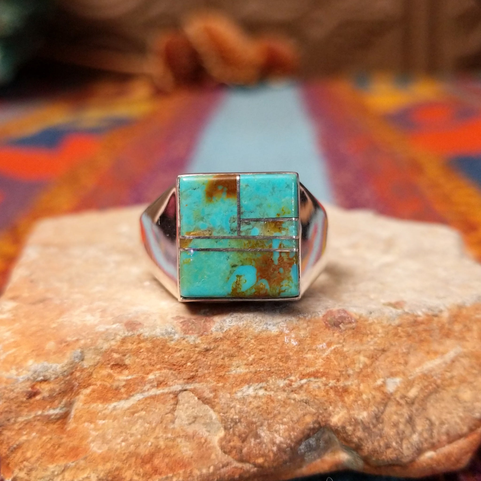 Square Turquoise Inlay Ring by Wilbert Grey featuring geometric turquoise inlay with natural brown matrix, separated by Sterling Silver channels and set on a polished silver band.