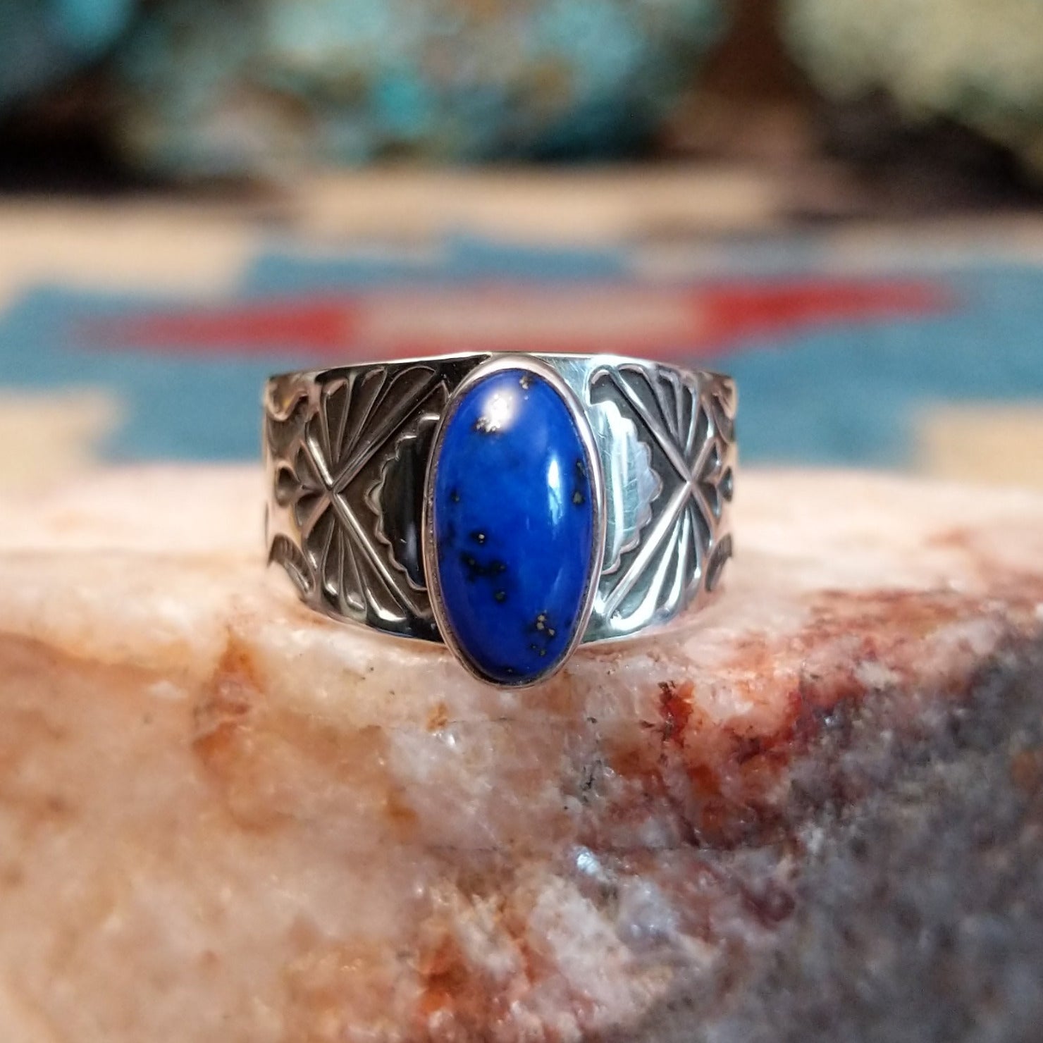 Sterling silver Navajo ring with lapis set in polished oval bezel.