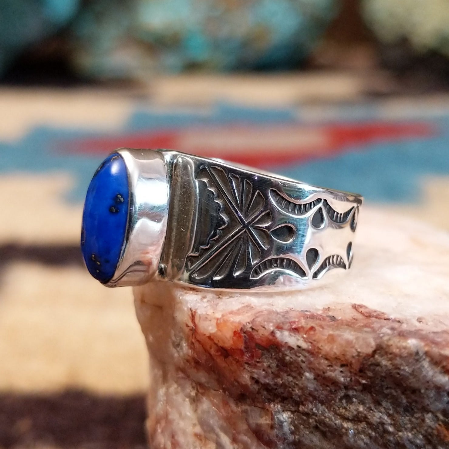 Sterling silver Navajo ring with lapis set in polished oval bezel.