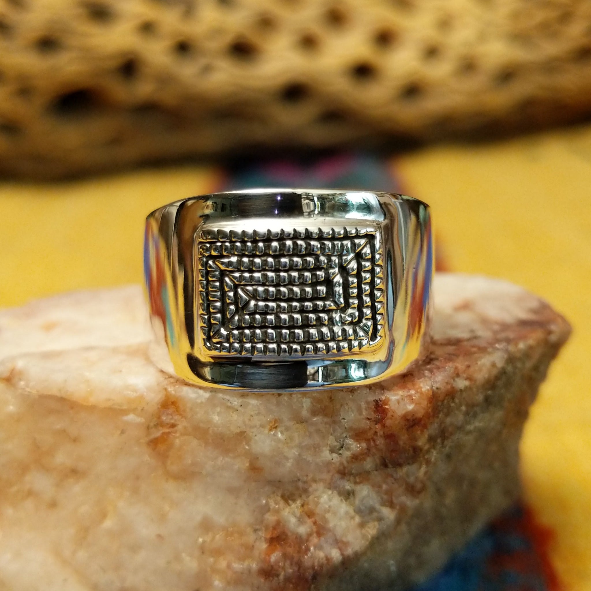 Stamped sterling silver ring by Raymond Coriz, featuring intricate hand-stamped patterns on a polished sterling silver band with traditional Southwestern-inspired craftsmanship.