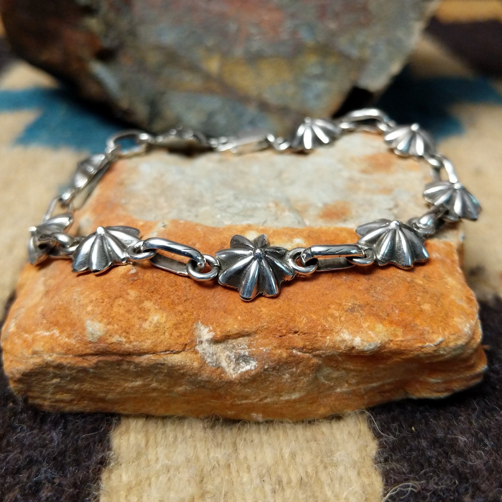 Sterling silver star link bracelet by Nabiho with handcrafted Southwestern star-shaped links.