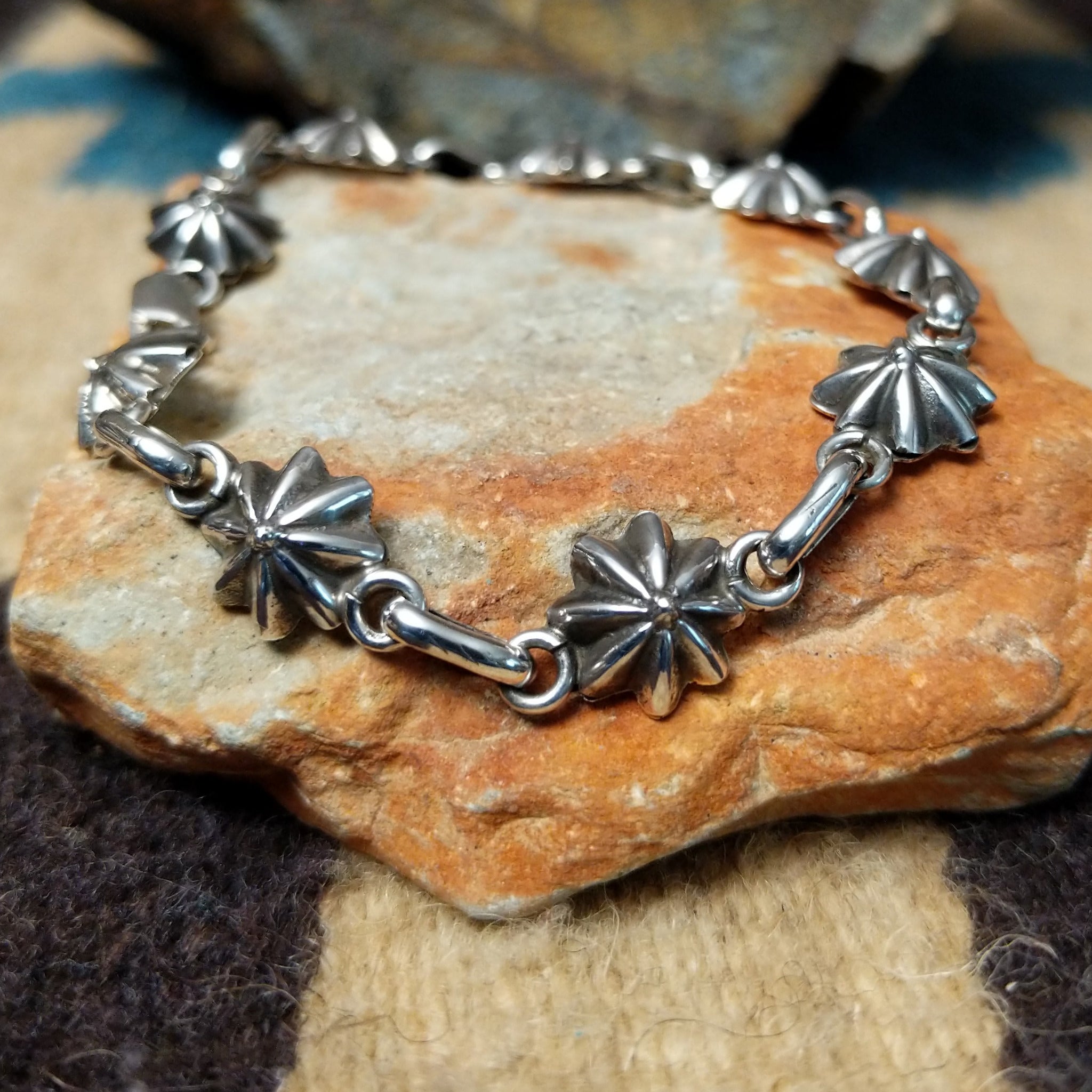 Sterling silver star link bracelet by Nabiho with handcrafted Southwestern star-shaped links.