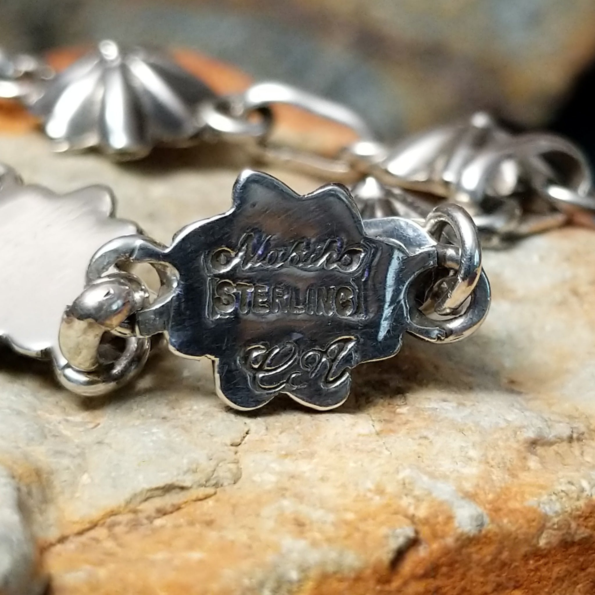 Sterling silver star link bracelet by Nabiho with handcrafted Southwestern star-shaped links; artisan, tribe, and Sterling Silver stamp.