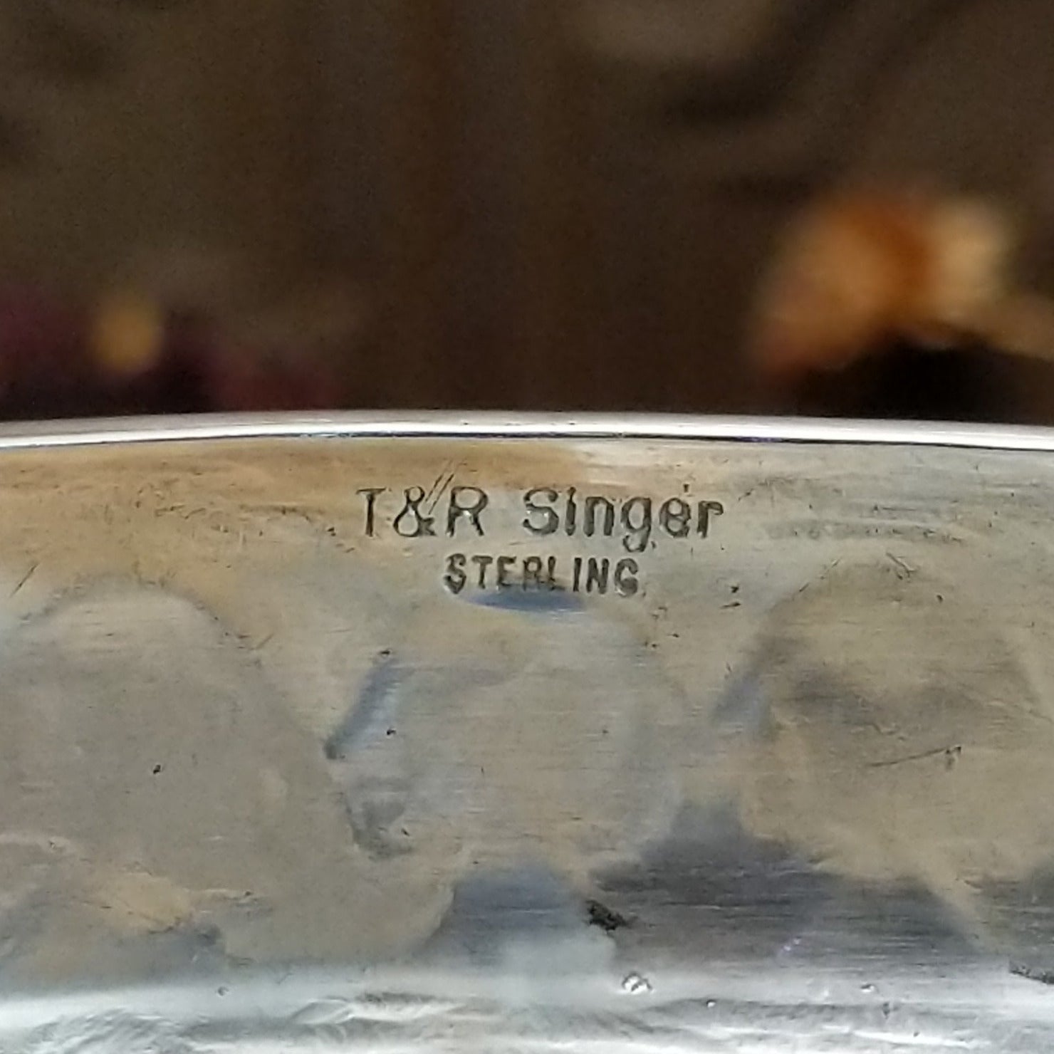 Close up of the artists stamped signatures.