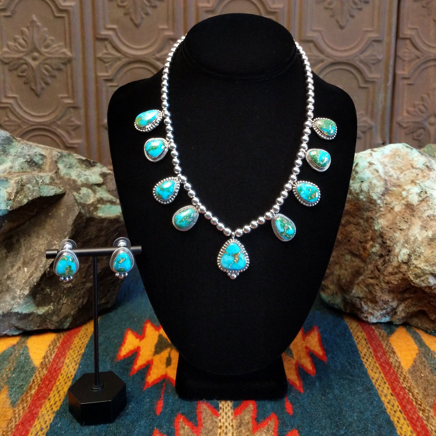 Sterling silver necklace and earrings set with Sonoran Gold turquoise set in notched bezels, framed by dotted accents and a beaded silver chain.
