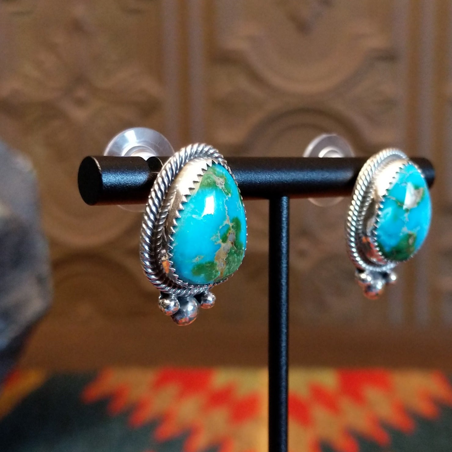 Sterling silver earrings with Sonoran Gold turquoise set in notched bezels, framed by dotted accents.