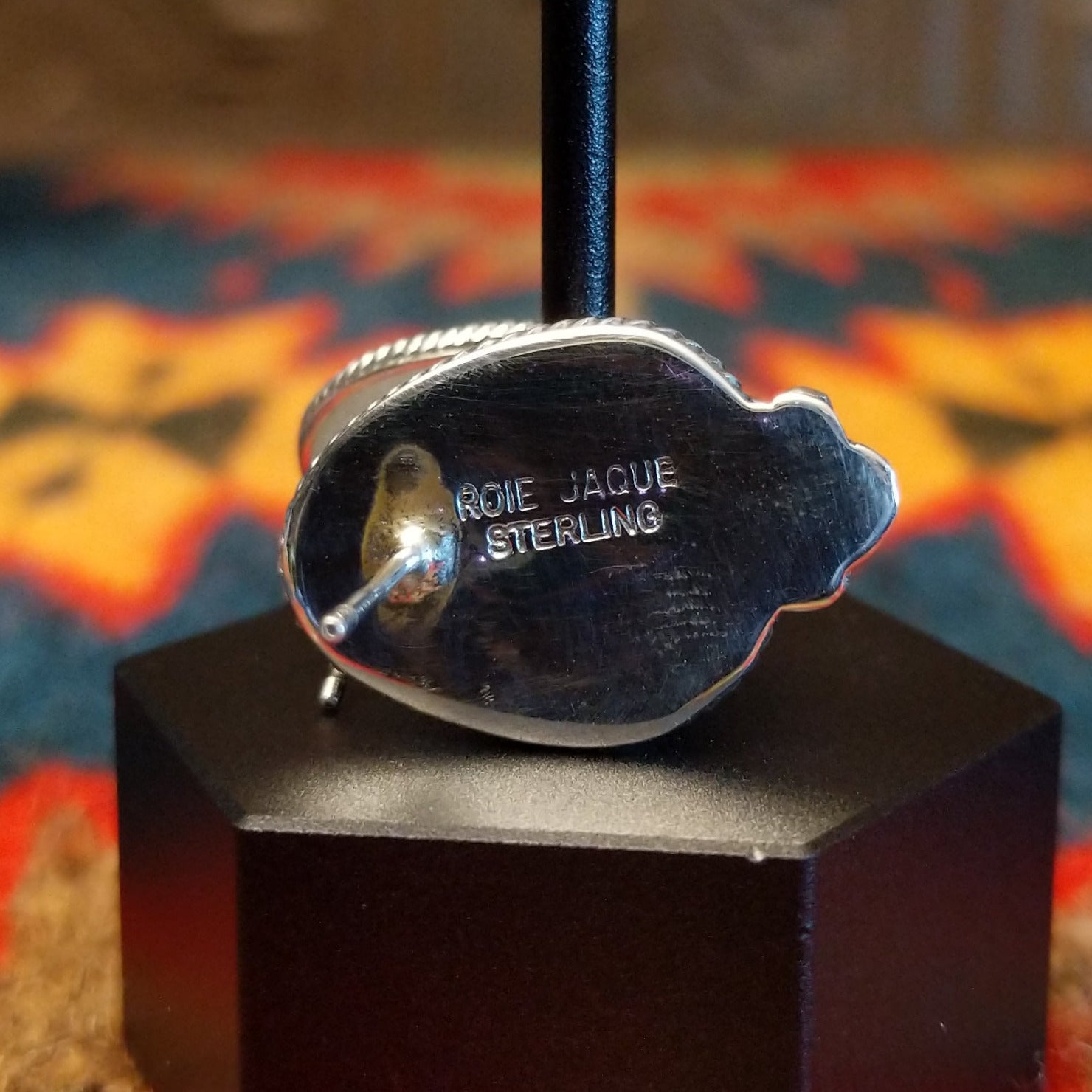 Close-up of the artisan's stamped signature.