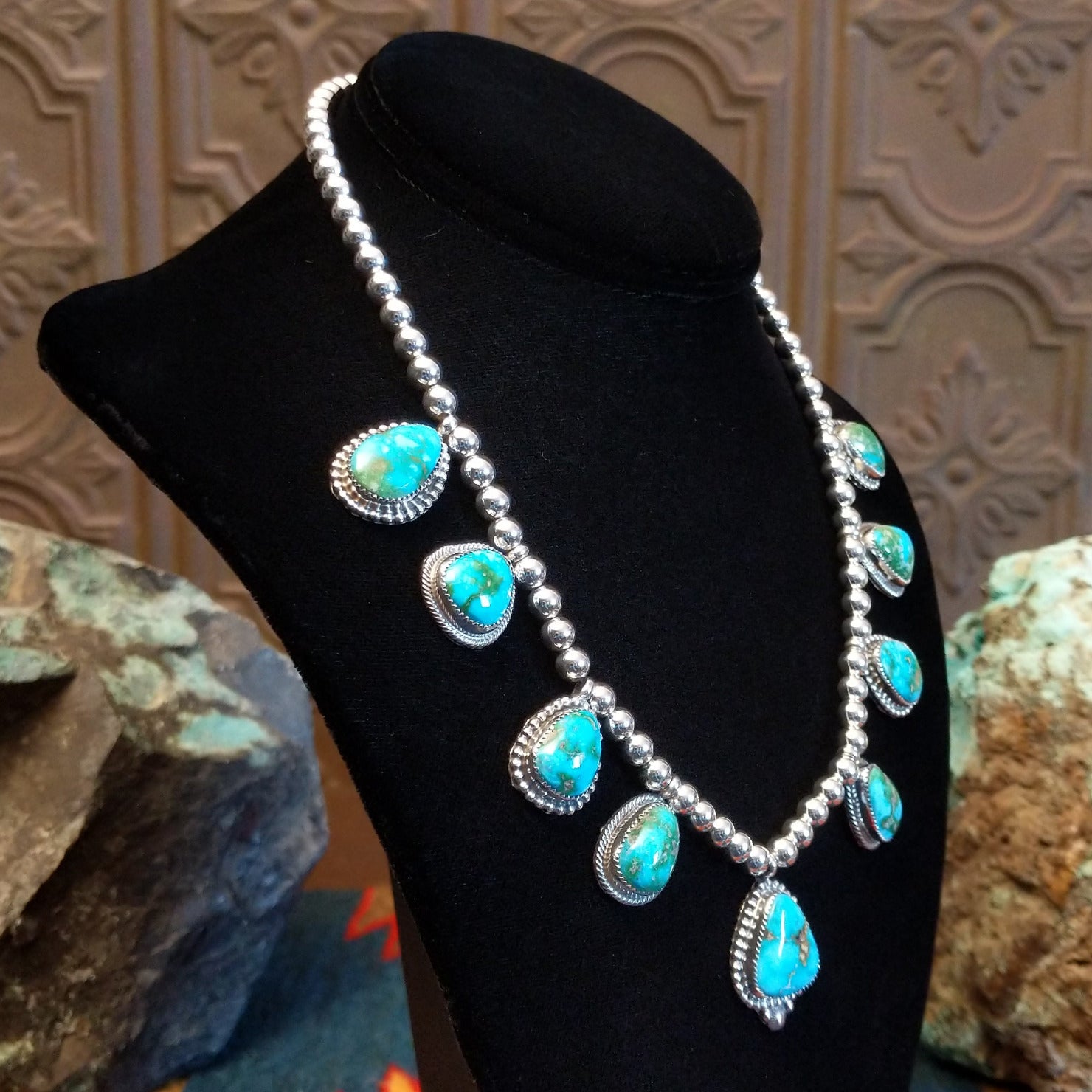 Sterling silver necklace with Sonoran Gold turquoise set in notched bezels, framed by dotted accents and a beaded silver chain.