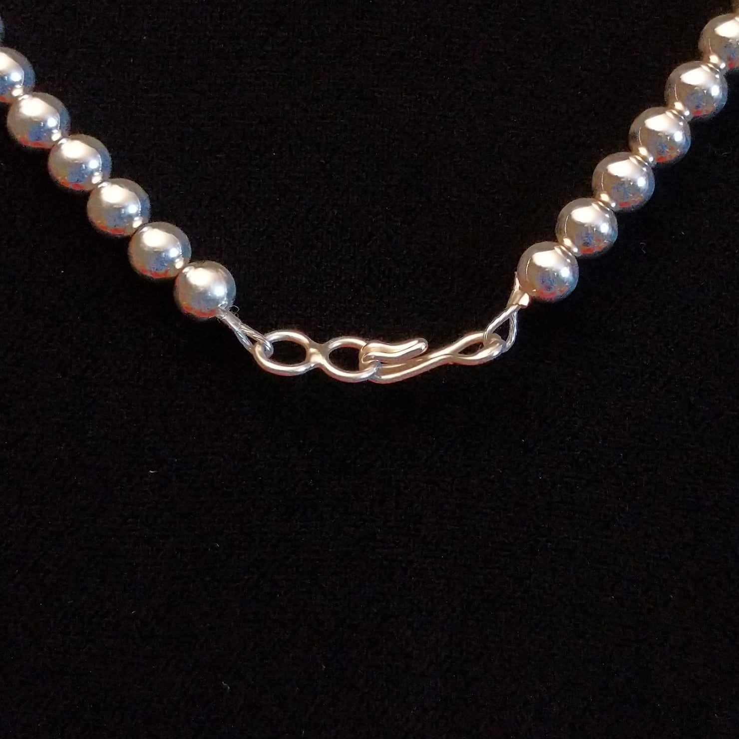 Close-up of the hook clasp on the necklace.